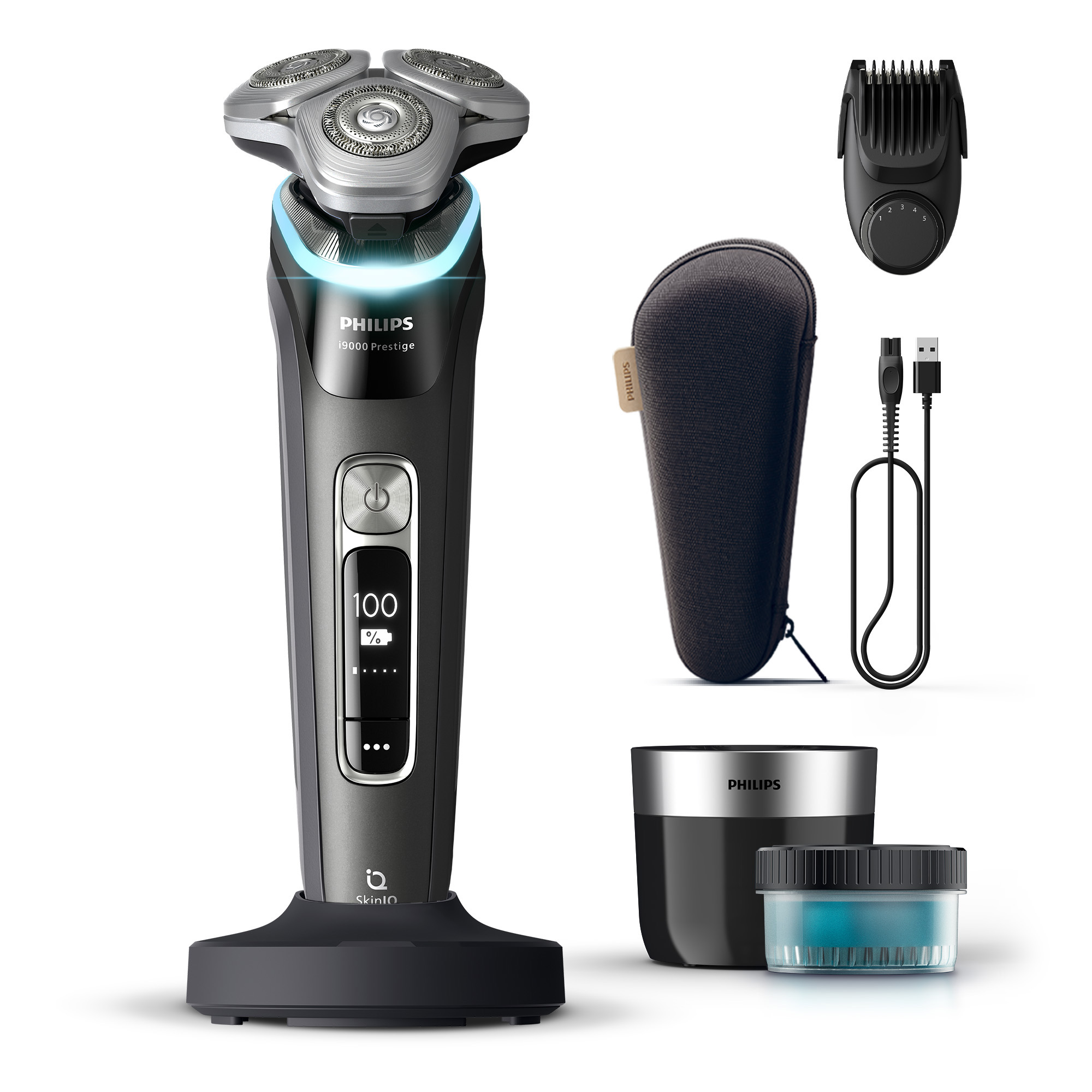 An electric shaver with accessories. It has a digital display showing 100%. Accessories include a trimmer, case, and charging base.