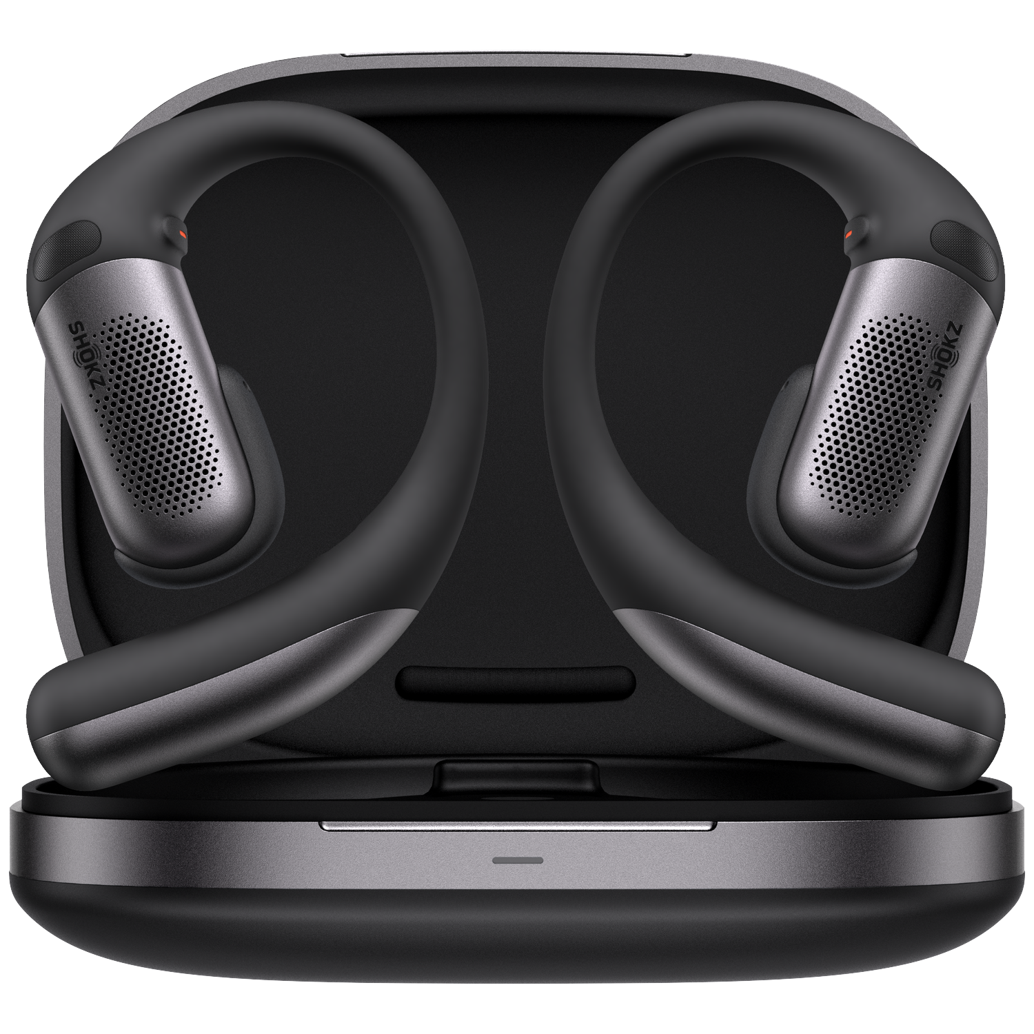 Black and gray Shokz headphones in a charging case. The headphones are bone-conduction and sit around the ear.