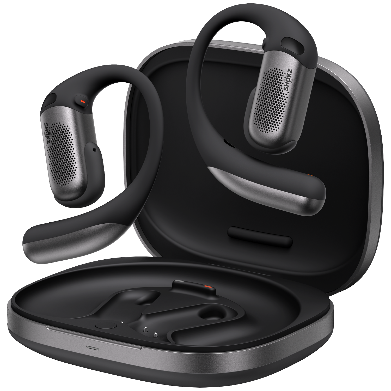 Black and gray Shokz headphones, one in a charging case, the other outside. Details include the brand logo and design.