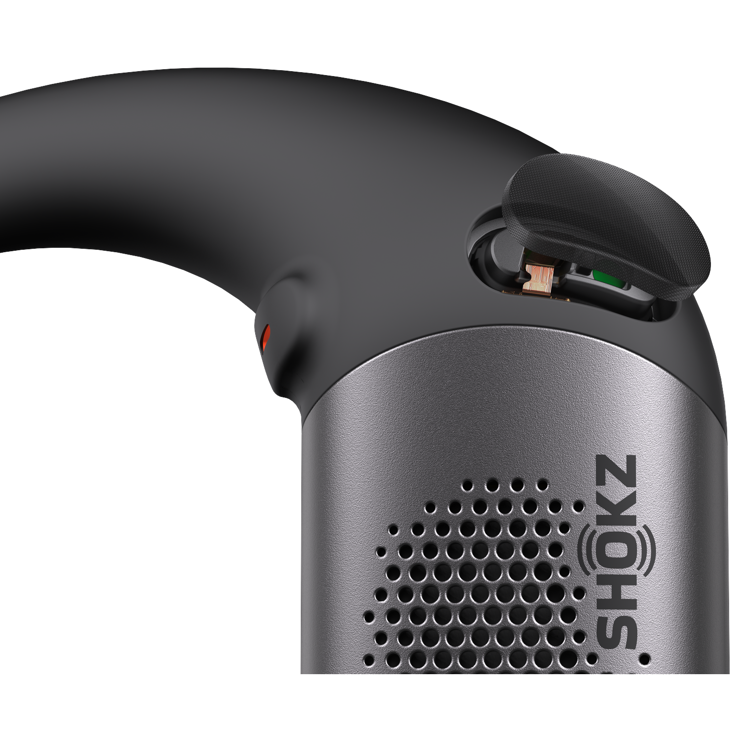 Close-up of a black and gray Shokz device. The device has an open compartment revealing internal components. The logo SHOKZ is on the side.