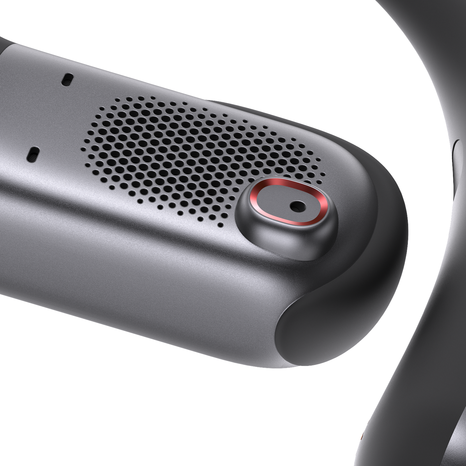 Close-up of a dark gray device with a speaker grille, a red-rimmed button, and a curved arm. White background.
