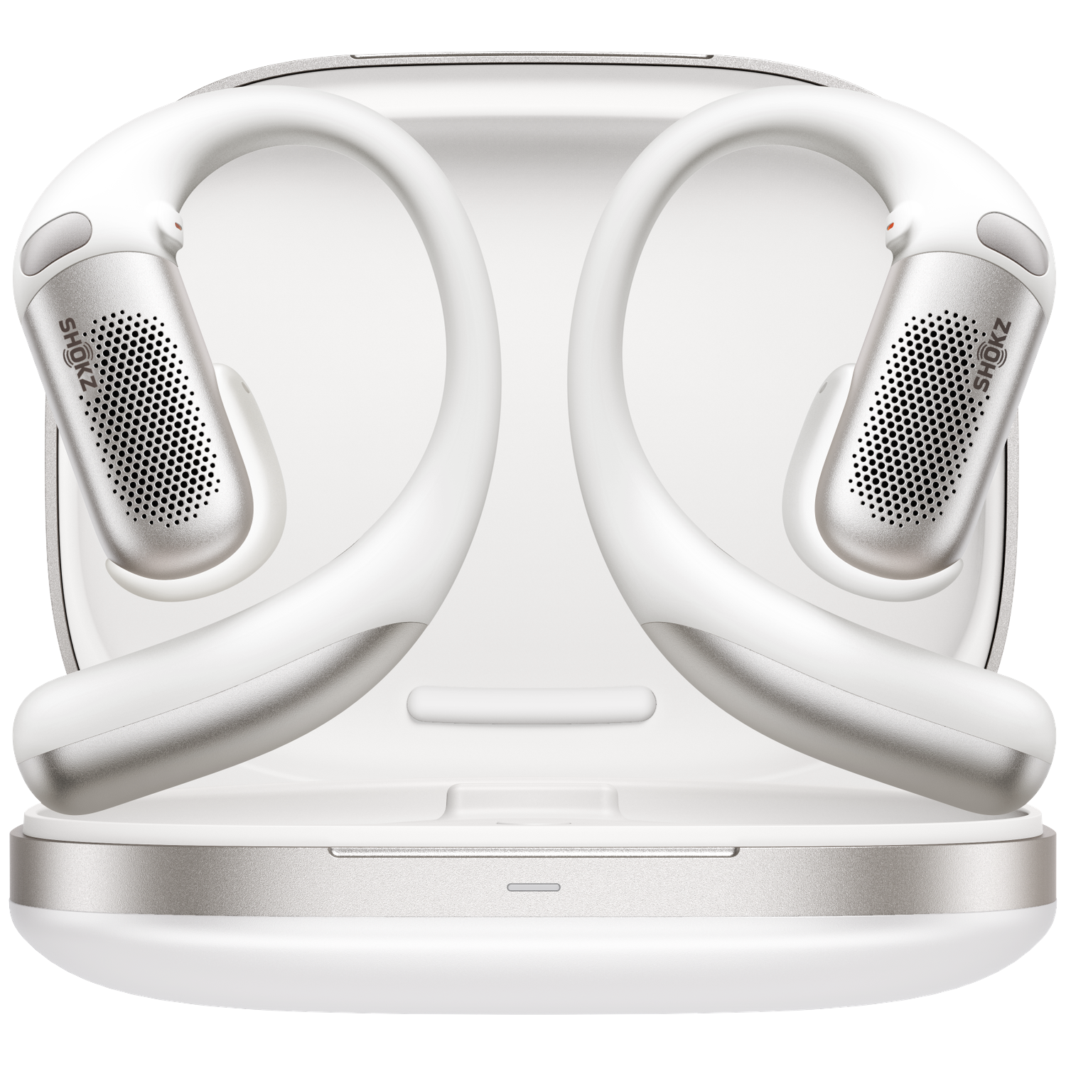 White and silver Shokz headphones in a white case. The headphones have a curved design and a small speaker. The case is open.