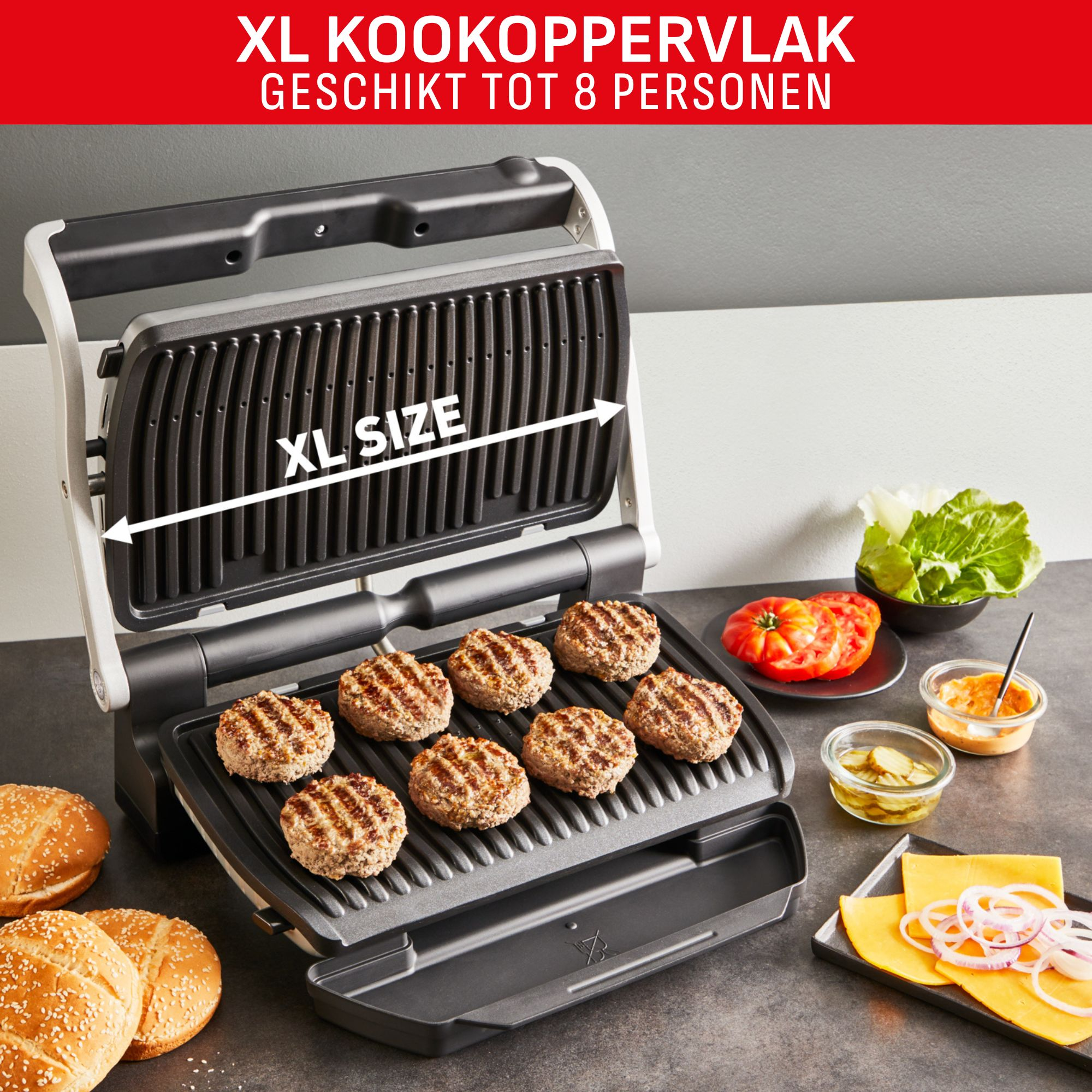 An XL grill with burgers, buns, and toppings. Tomatoes, lettuce, cheese, and pickles are also present.