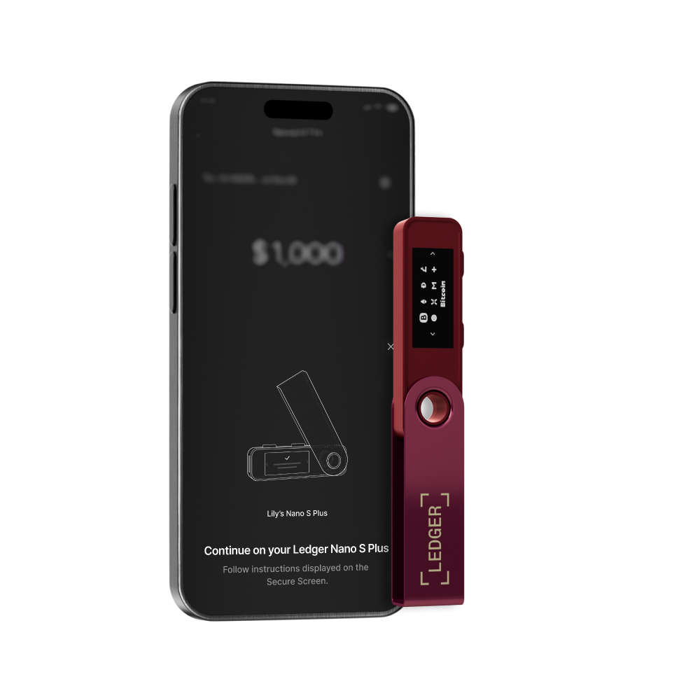 Un monedero hardware Ledger Nano S Plus junto a una pantalla de teléfono que muestra una transacción de $1,000. La cartera es roja.