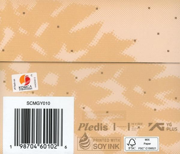 Kartonverpackung mit Barcode, KOMCA-Aufkleber und Logos. Text enthält 'Printed with Soy Ink' und 'MIX Paper'.