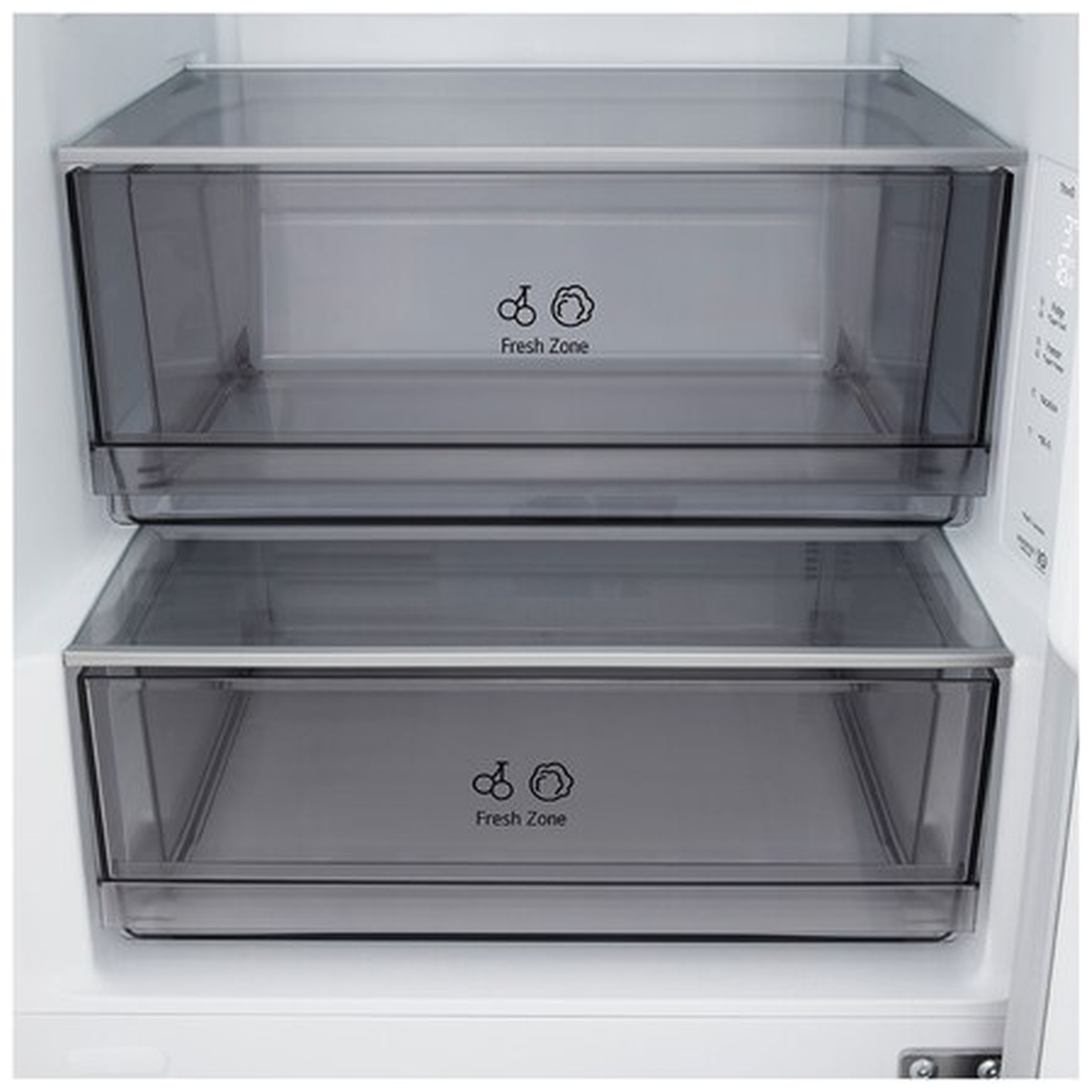 Inside a refrigerator, two transparent drawers labeled 'Fresh Zone' are visible. The drawers are empty, and the background is white.