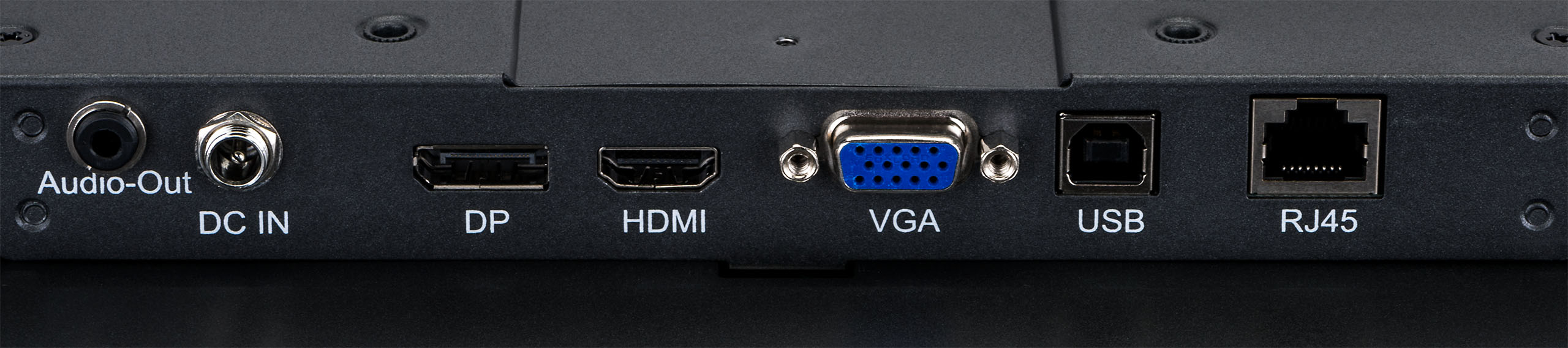 Nahaufnahme der Rückseite eines schwarzen Geräts. Es hat Audio-, DC-In-, DP-, HDMI-, VGA-, USB- und RJ45-Anschlüsse.