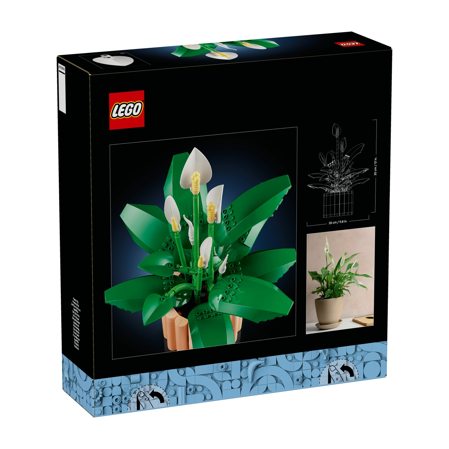Scatola del set LEGO con una pianta di giglio della pace LEGO. La scatola ha il logo LEGO e immagini della pianta. La pianta ha fiori bianchi e foglie verdi.