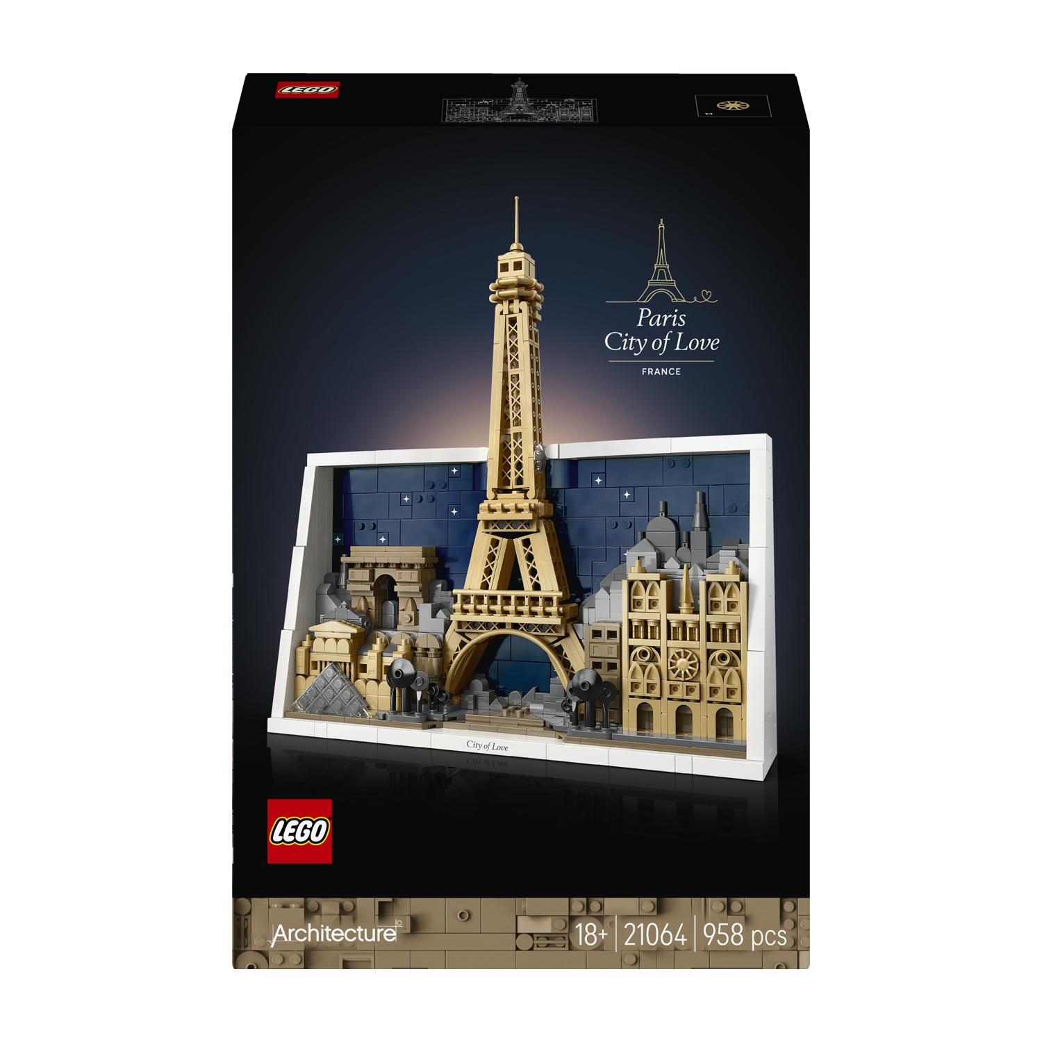 Una scatola Lego mostra una scena di Parigi, con la Torre Eiffel e altri monumenti, su sfondo blu scuro.