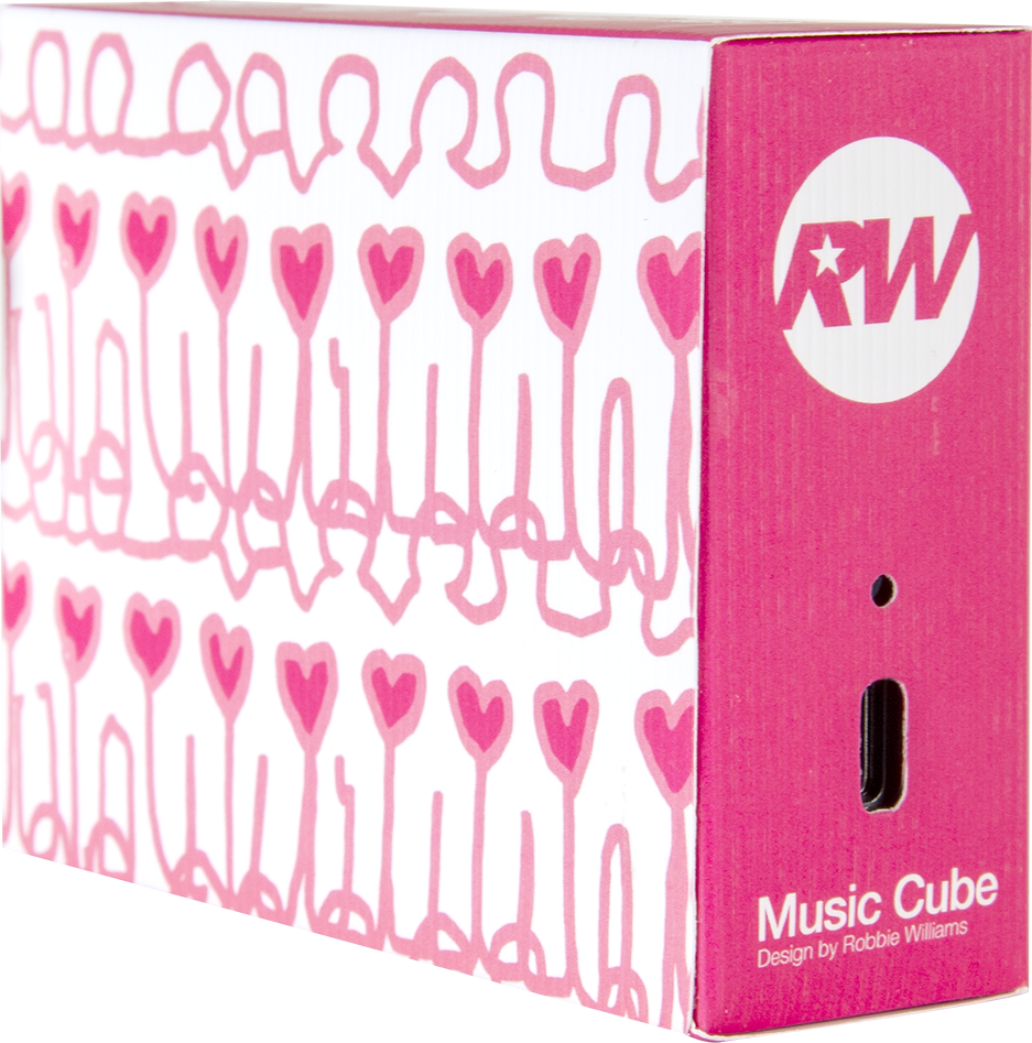Rózsaszín és fehér zenei kocka doboz. A dizájn szíveket és logót tartalmaz. A szöveg a 'Music Cube' és a 'Design by Robbie Williams'.