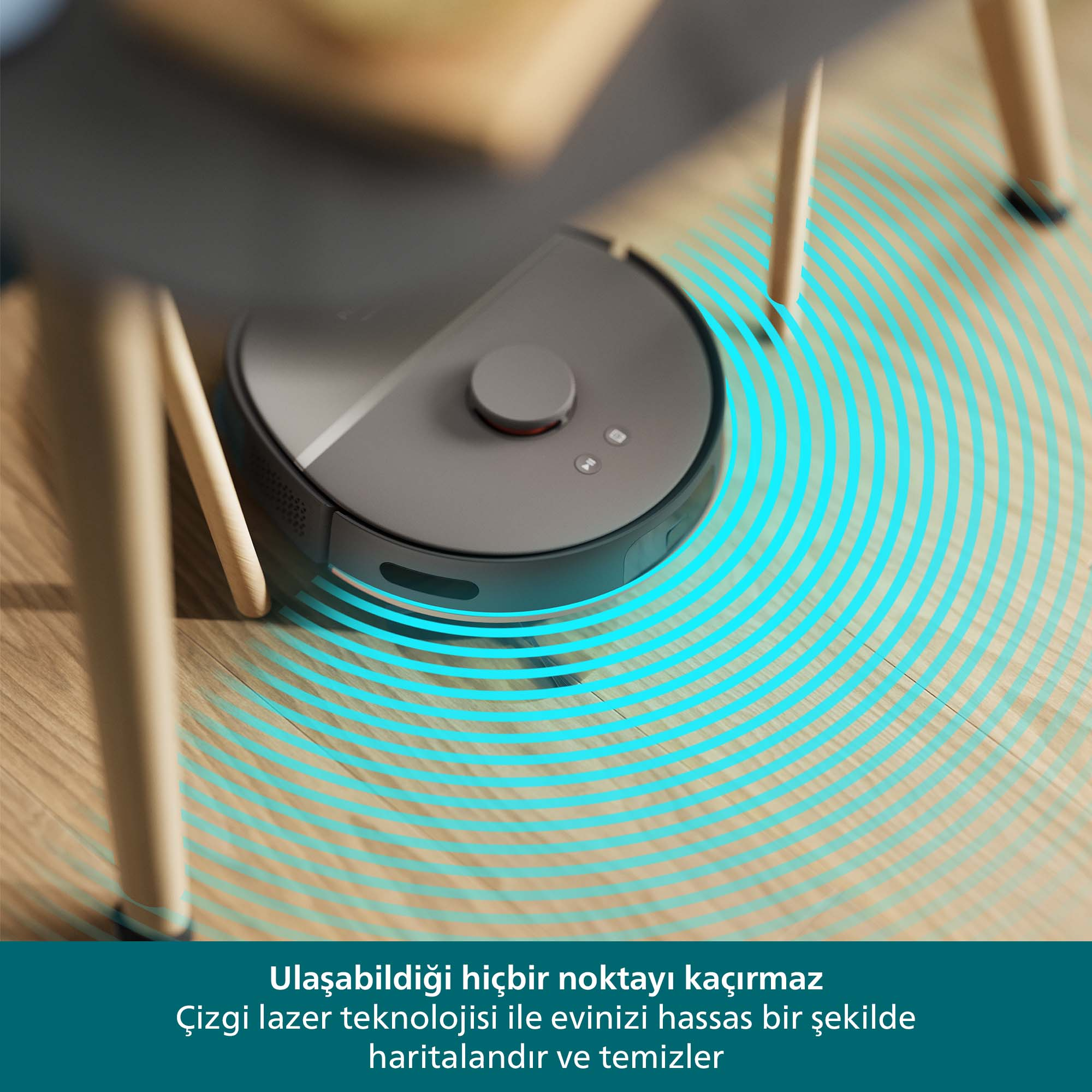 Mavi ışık dalgalarıyla bir masanın altında ahşap zemini temizleyen bir robot süpürge.