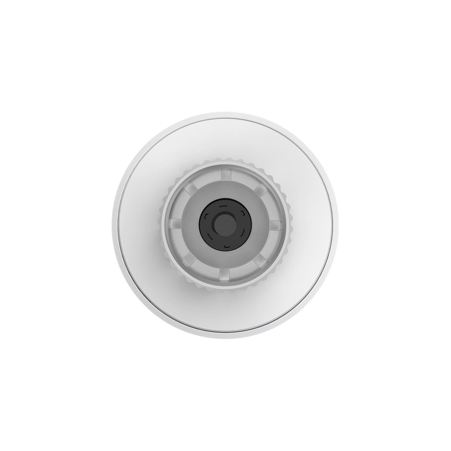Top view of a white device with a gray center, showing circular layers and a dark central element.