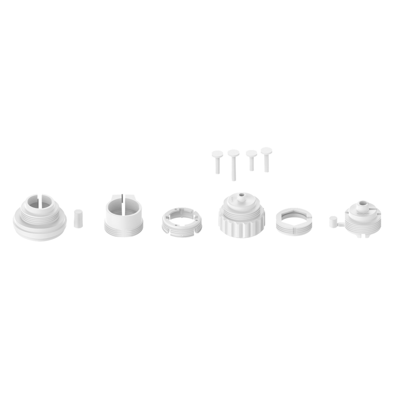Several white plastic parts, including nozzles and connectors, are arranged on a white background. Small pegs are also present.