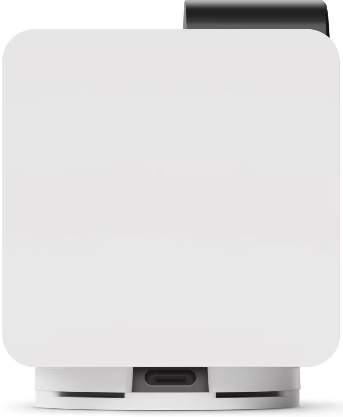 Un dispositivo bianco con angoli arrotondati, parte superiore nera e porta USB-C in basso. Poggia su una base bianca.