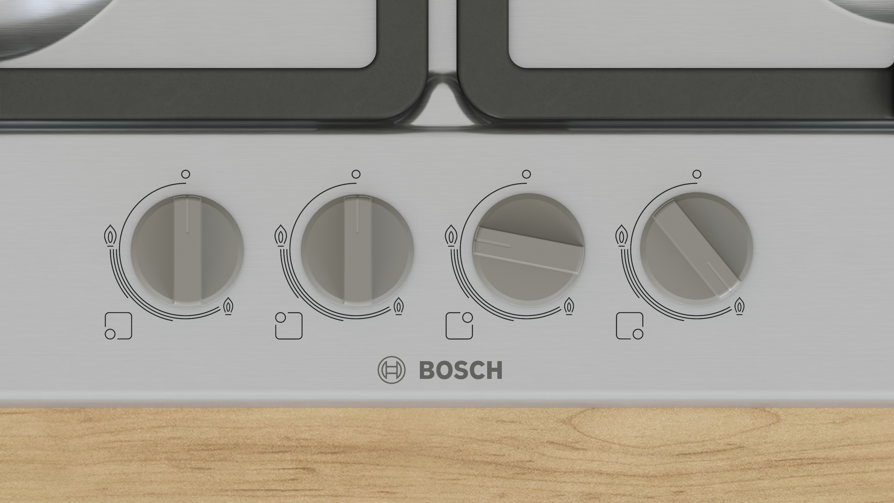 Close-up van een Bosch-kookplaat bedieningspaneel met vier knoppen. Knoppen zijn grijs, kookplaat is zilver, en het houten paneel is eronder.