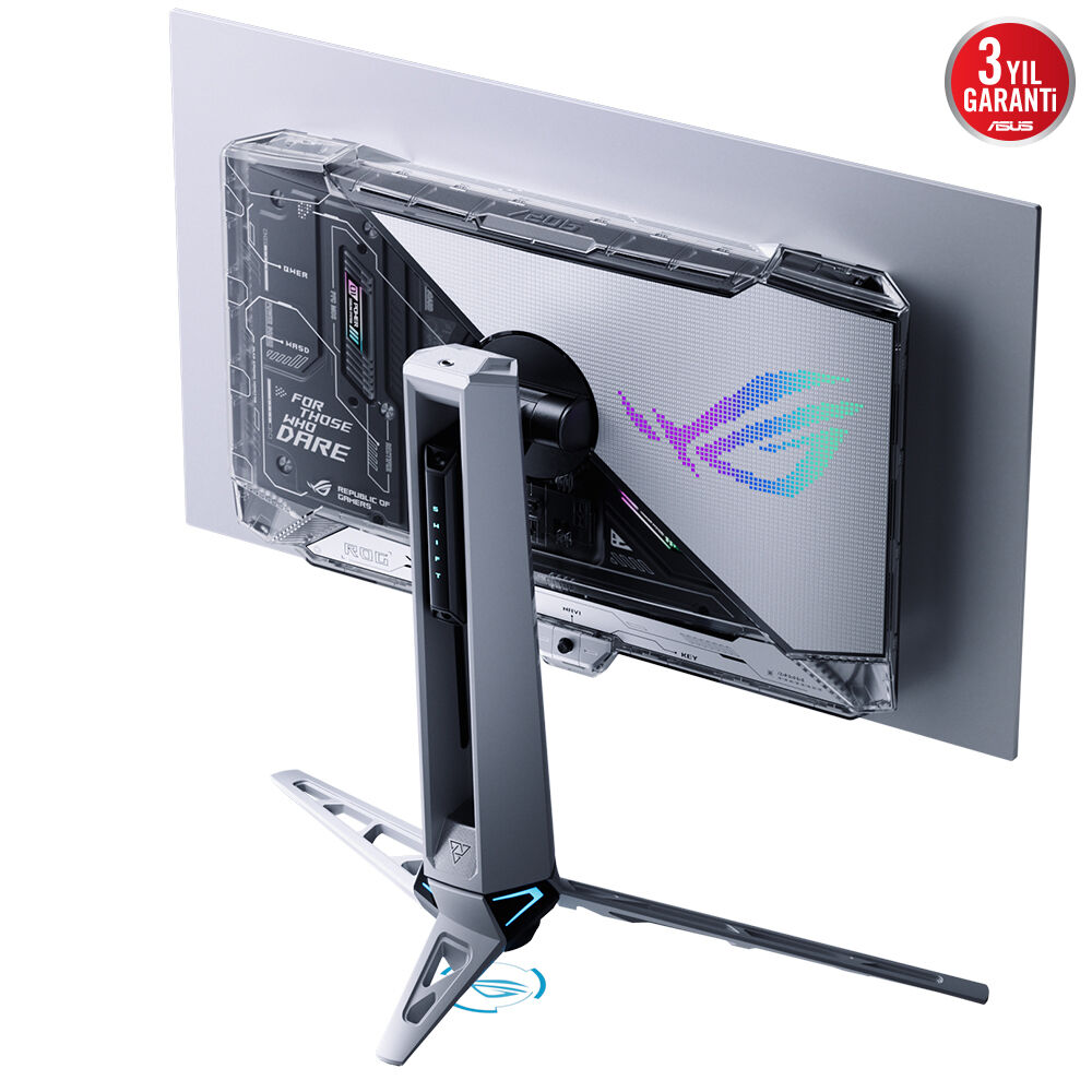 Bir oyun monitörünün arkadan görünümü. Gri ve beyaz renkler hakim. Monitörün şeffaf bir arka kapağı var ve üzerinde yazı var. Asus logosu ve garanti etiketi.