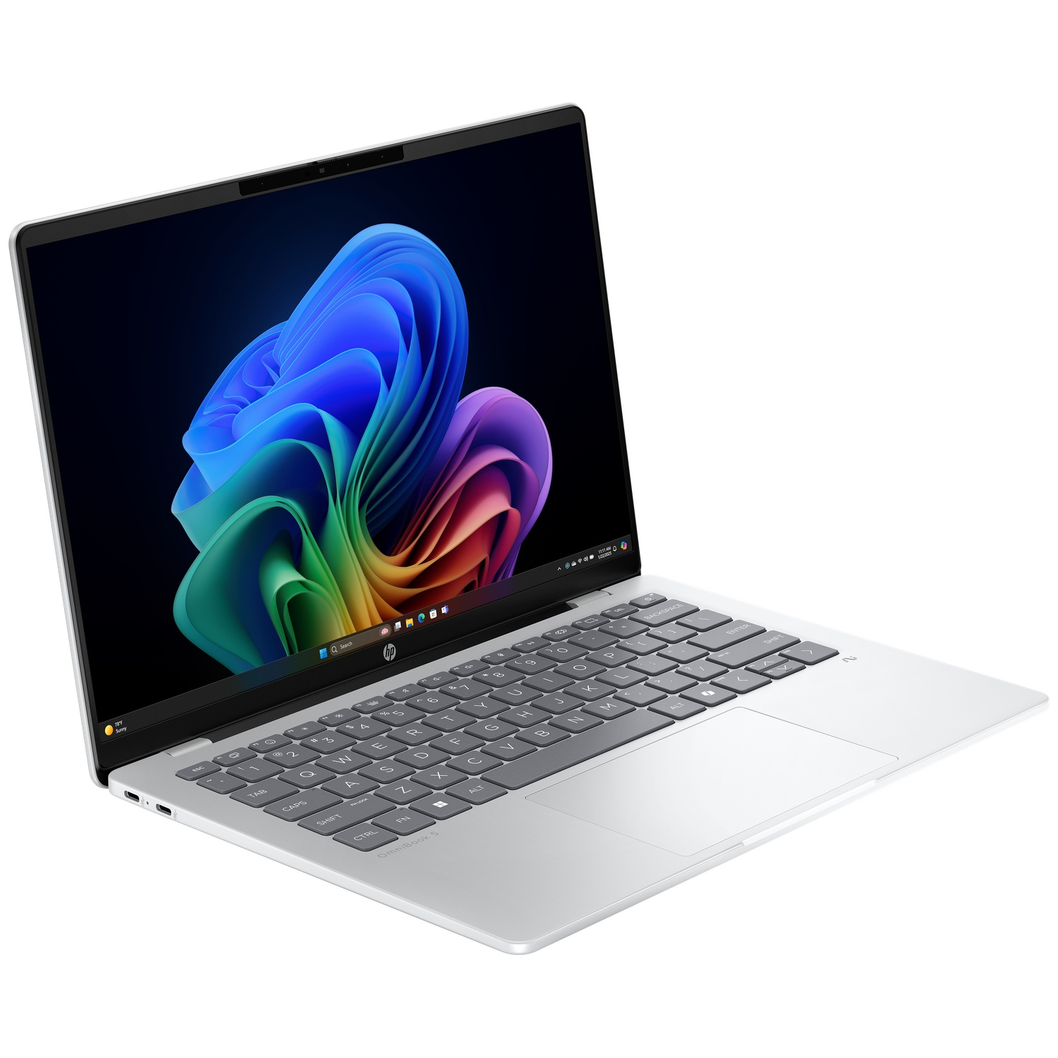Silver HP laptop open on a white surface, displaying a colorful abstract image. Keyboard and touchpad visible. Bright lighting.