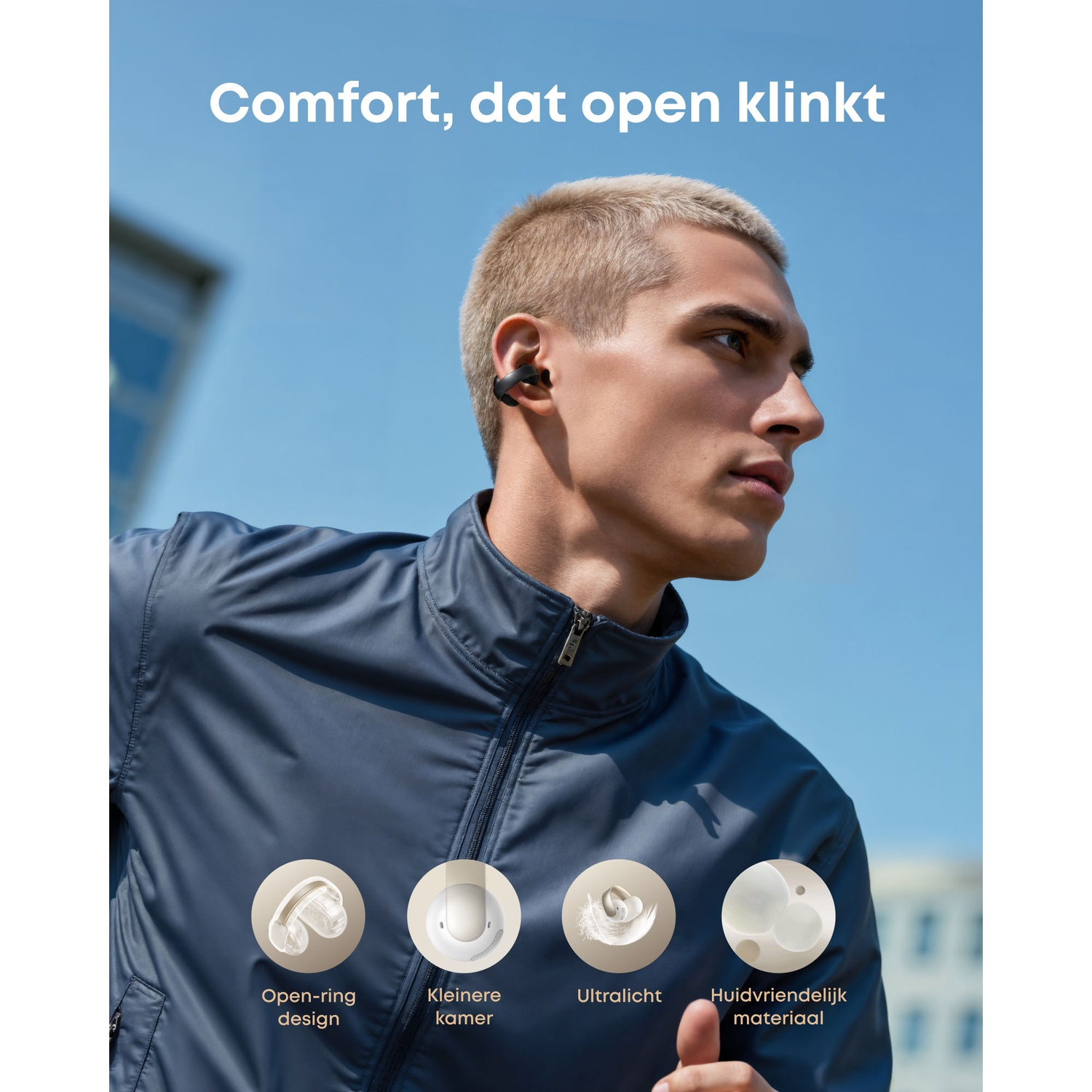 Een man met oortelefoons rent tegen een blauwe lucht. Tekst: Comfort, dat open klinkt. Pictogrammen: open-ring design, kleinere kamer, ultralicht, huidvriendelijk materiaal.