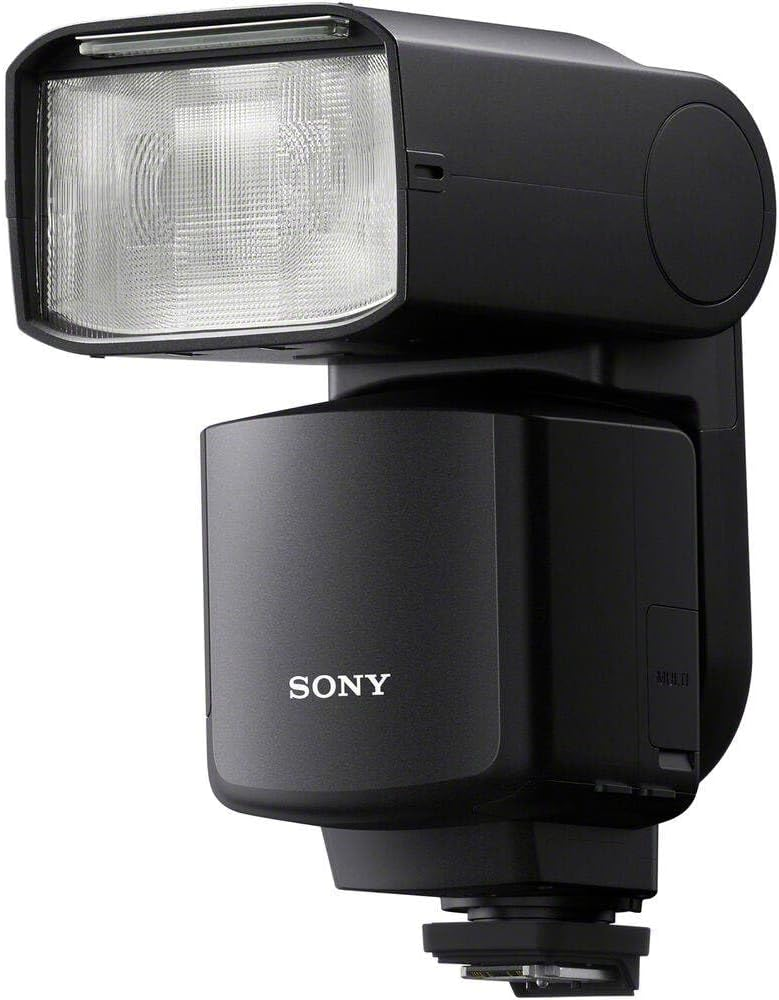 Siyah bir Sony kamera flaşı. Dikdörtgen bir flaş kafasına, silindirik bir gövdeye ve bir montaj ayağına sahiptir. Sony logosu görünür.