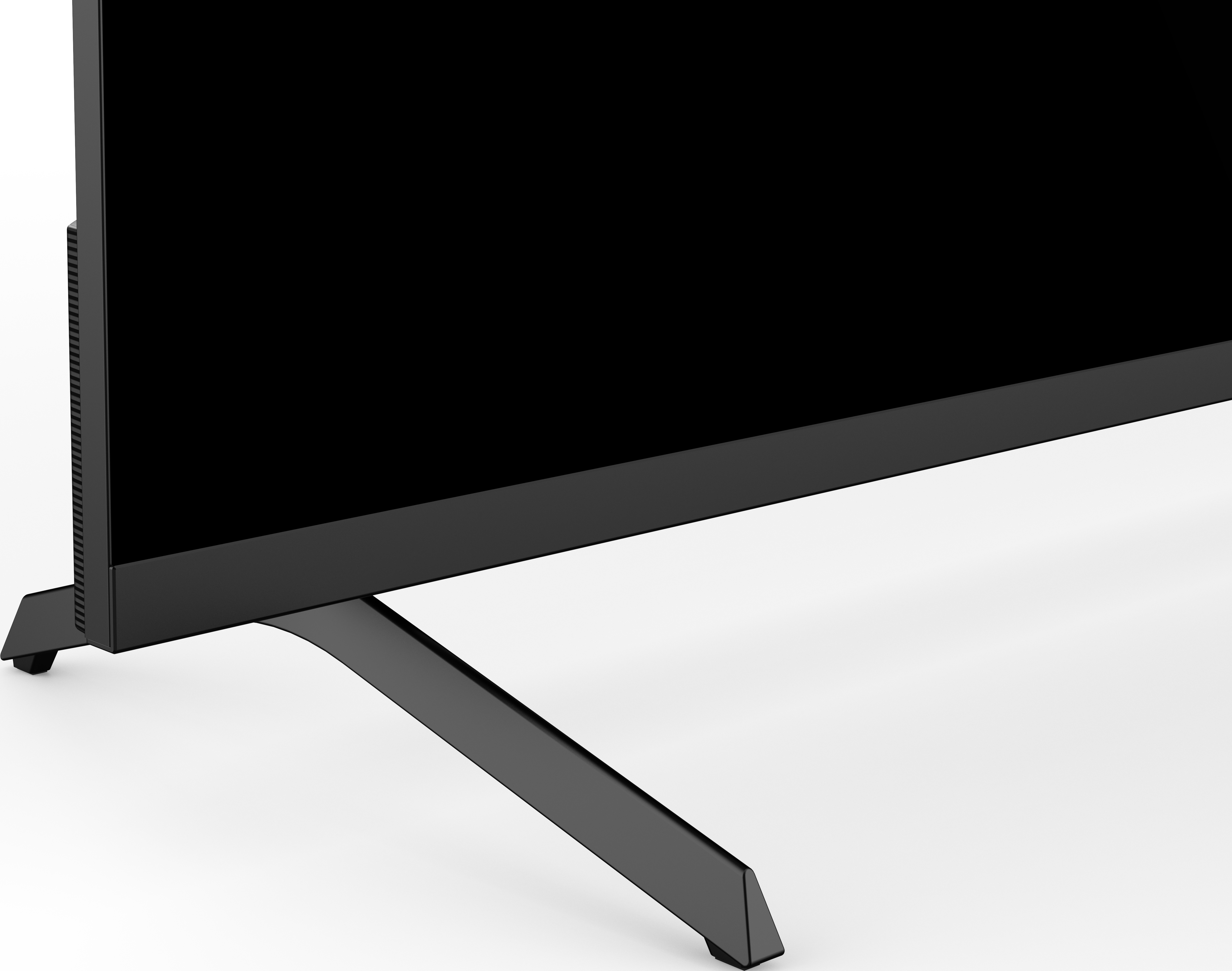 Un téléviseur noir sur une surface blanche. L'écran est noir. Un pied noir le soutient.