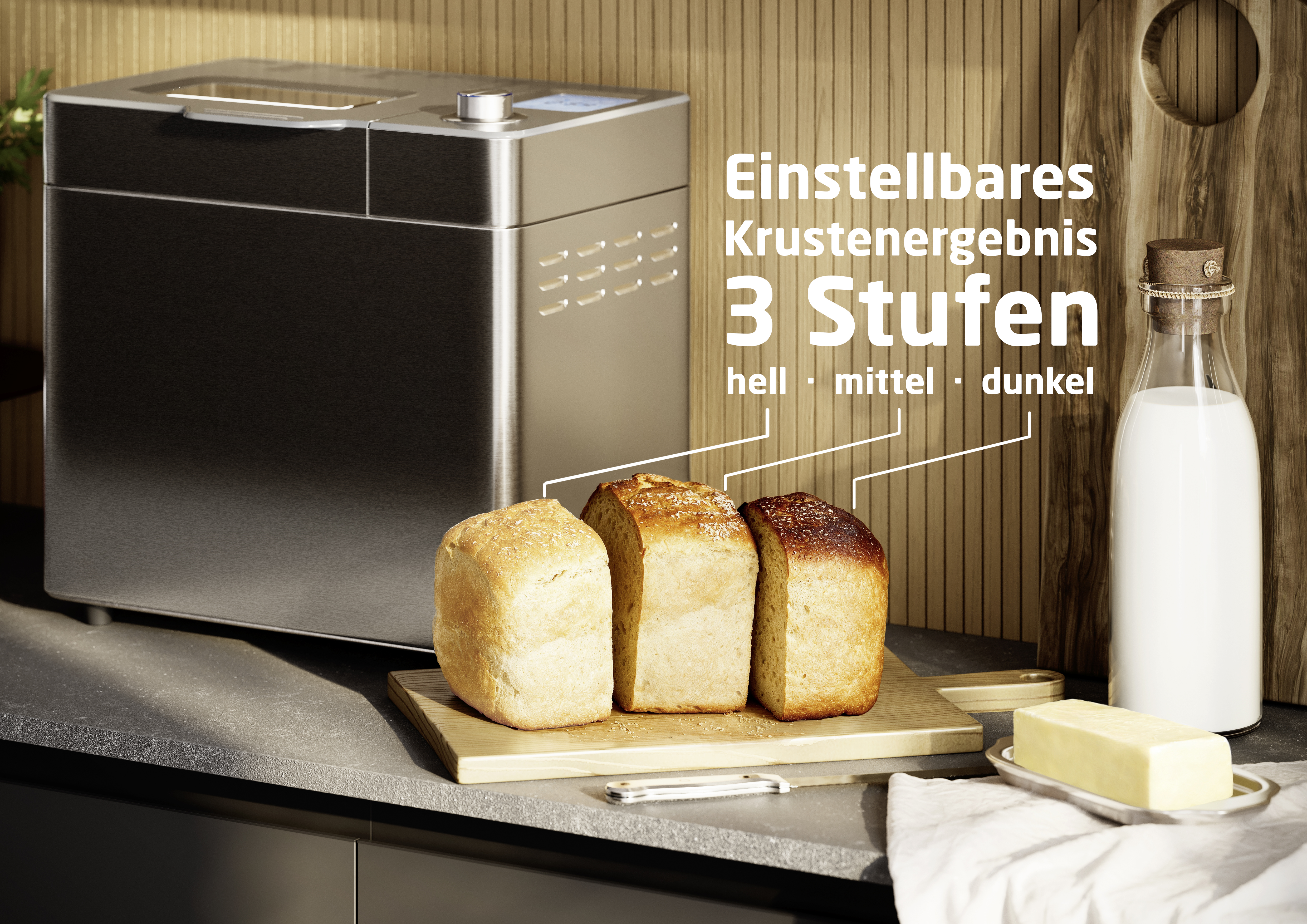Brotbackautomat mit drei Broten, Holzbrett, Milchflasche, Butter und Messer. Das Brot hat drei Krustenstufen: hell, mittel und dunkel.