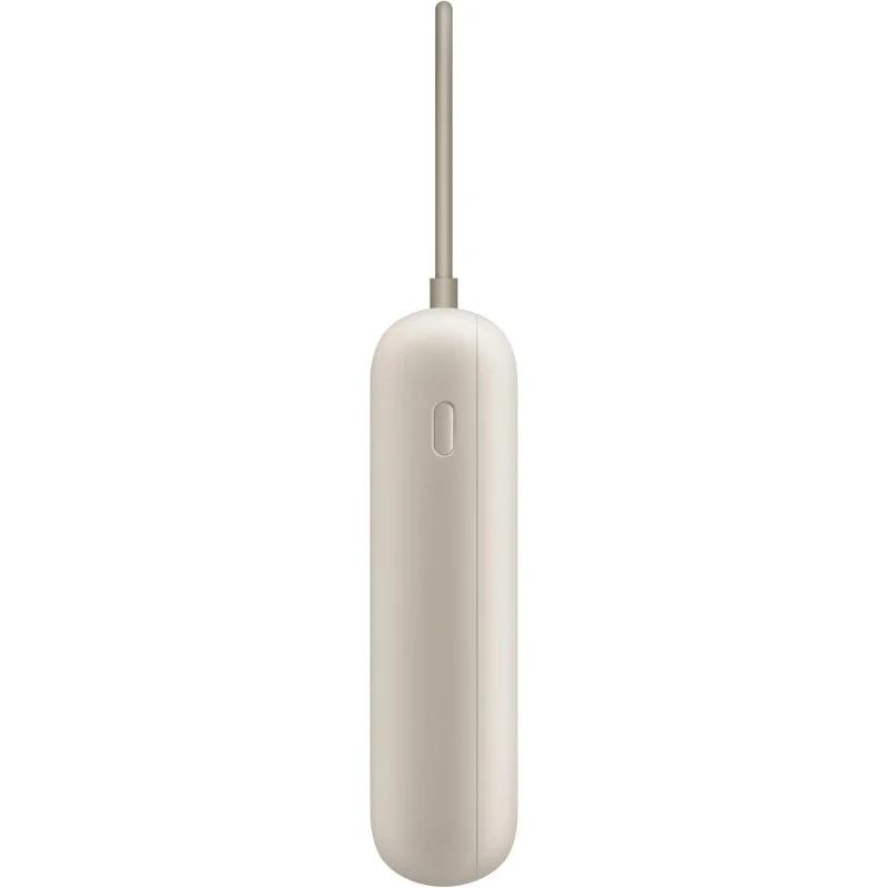 Un dispositivo cilíndrico beige con antena plateada. Tiene un botón ovalado al frente.