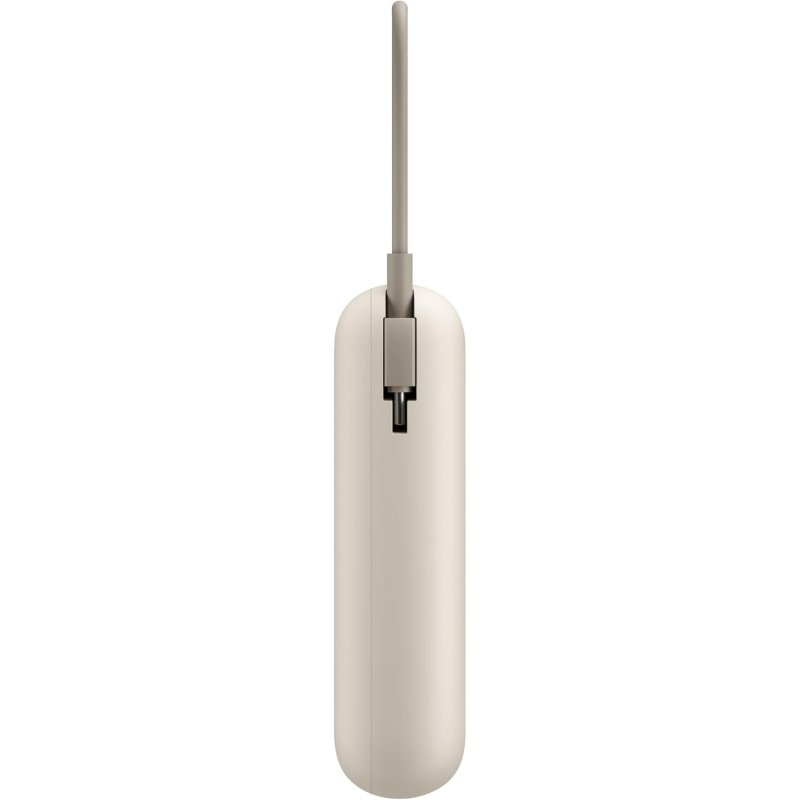 Un dispositivo beige con una asa gris en la parte superior. Parece un bolígrafo o un pequeño mando a distancia, aislado sobre fondo blanco.