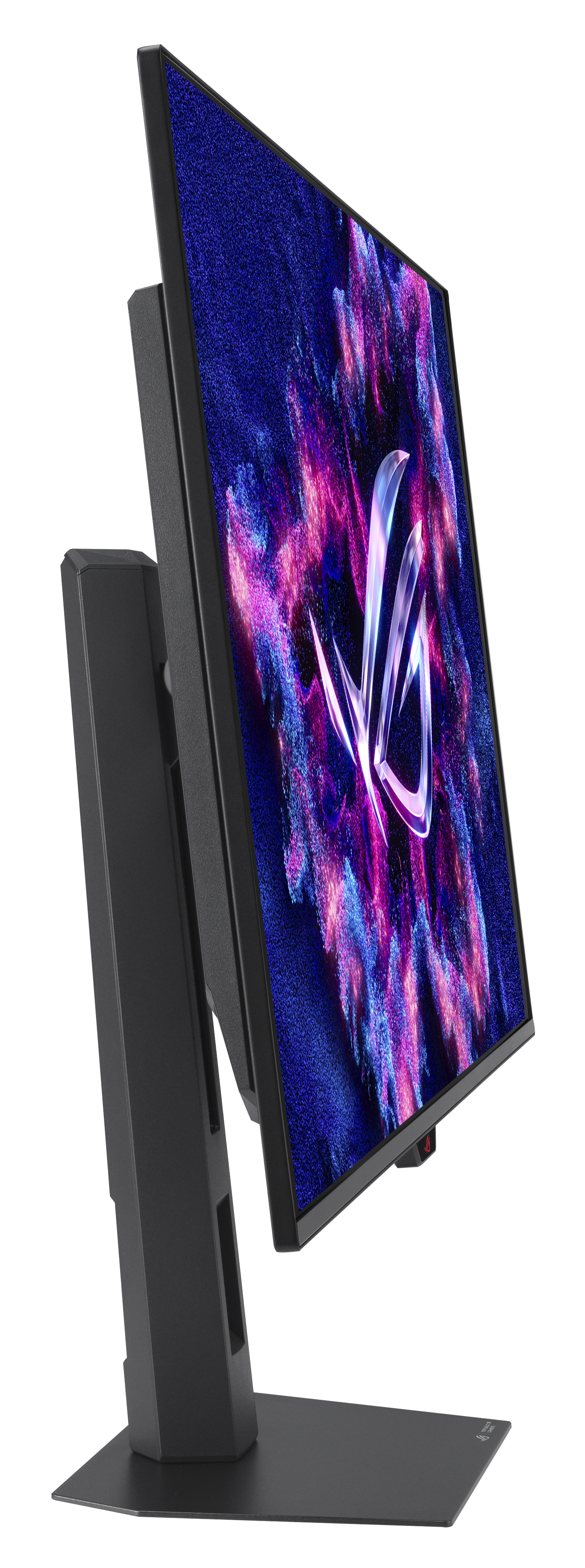 Czarny monitor komputera, pochylony, z kolorowym ekranem. Ma podstawkę i widoczne jest logo ROG.