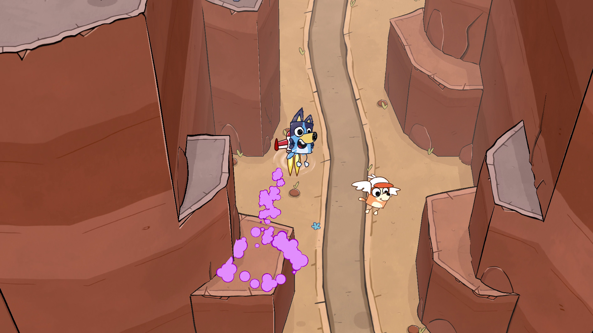 Bluey con mochila cohete y Bingo con alas vuelan sobre un cañón. Humo púrpura sale del jetpack de Bluey.