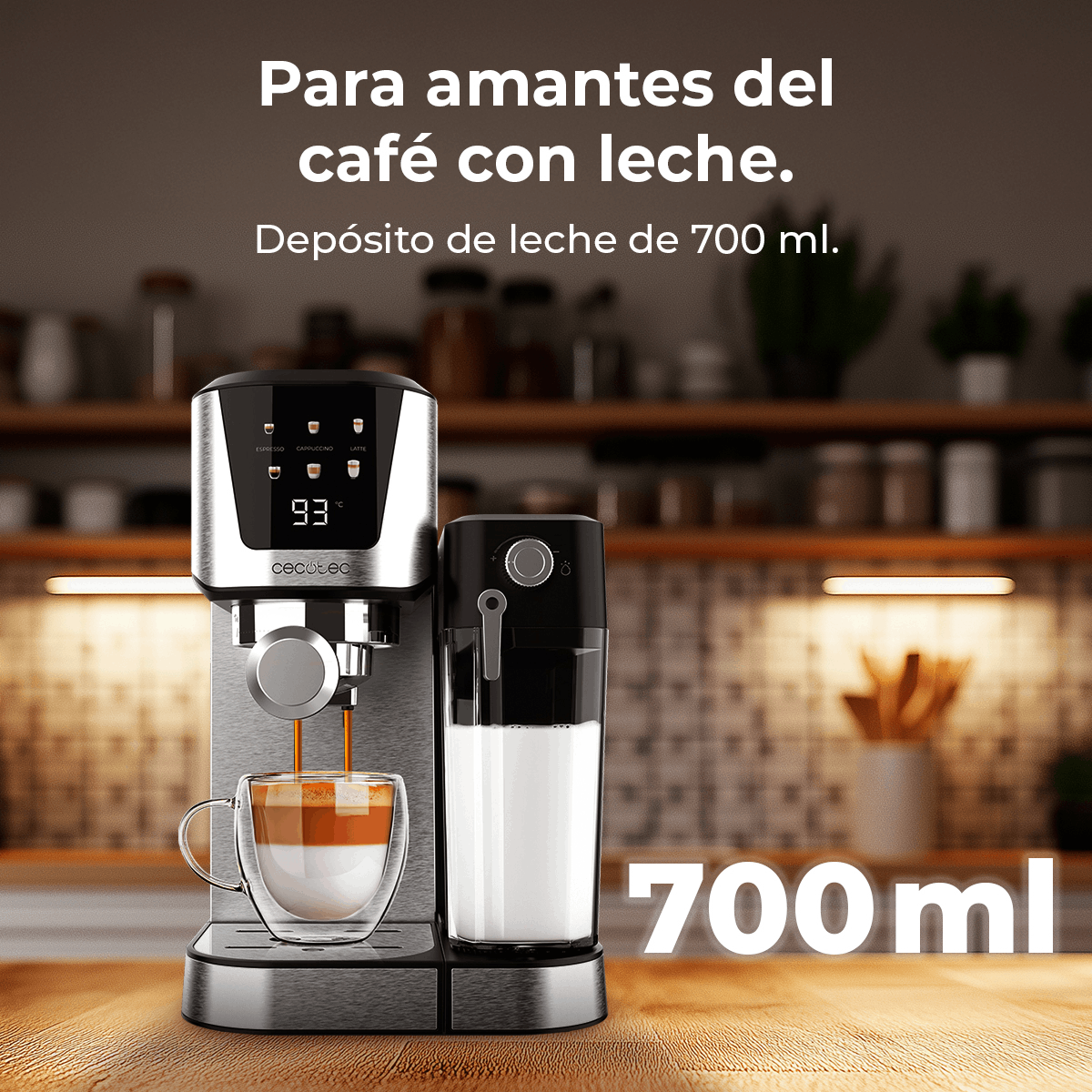 Una cafetera con una taza de vidrio que se llena de café y leche. La máquina tiene un recipiente para leche. La imagen tiene texto.