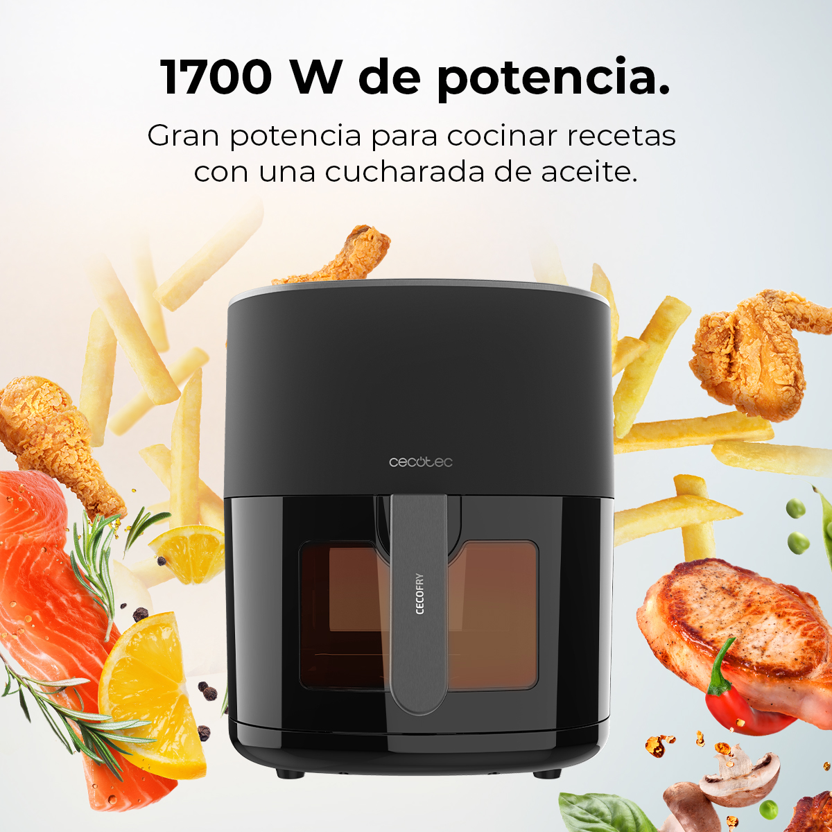 Freidora de aire negra con alimentos como pollo, papas fritas y salmón. Texto: 1700 W de potencia. Gran potencia para cocinar recetas.