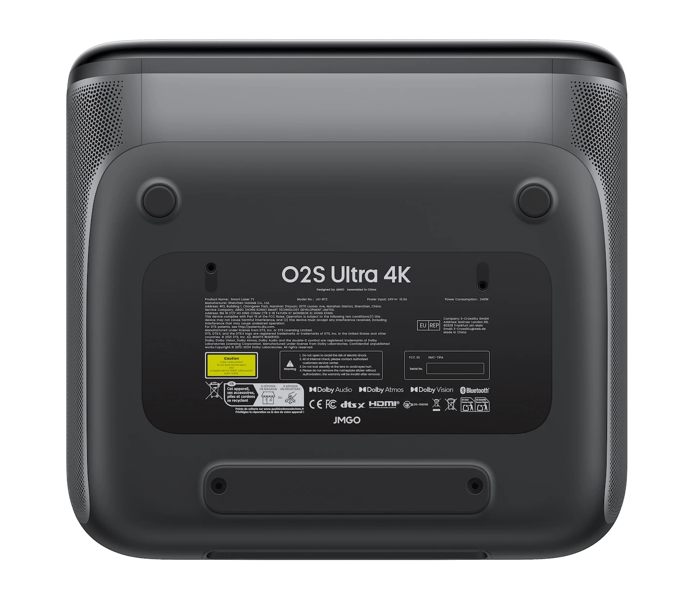 Czarna podstawa projektora z etykietami, logo i otworami wentylacyjnymi. Zawiera informacje o produkcie i ostrzeżenia.