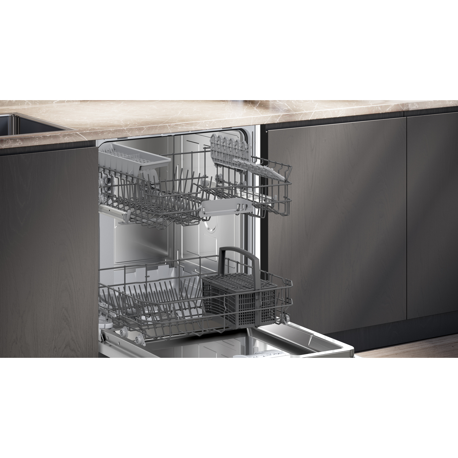 Open dishwasher with empty racks. Dark grey cabinetry surrounds the appliance. A marble countertop sits above the dishwasher.