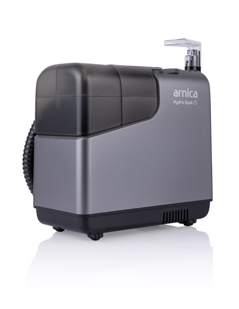 Gri ve siyah bir Arnica Hydra Spot makinesi. Hortumu, şeffaf bir musluğu ve yan tarafta marka adı var.