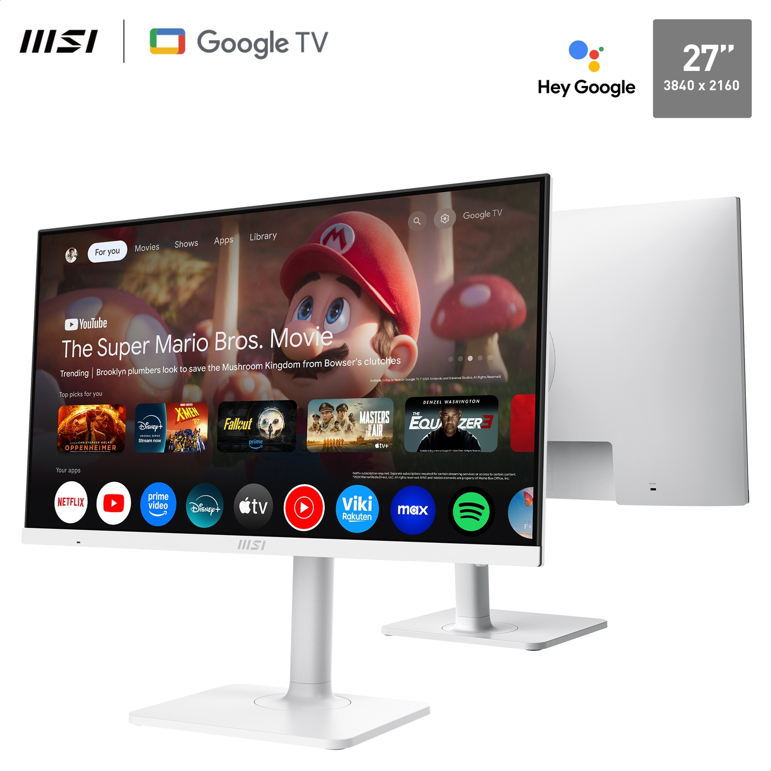 A white MSI monitor displays Google TV interface. The screen shows 'The Super Mario Bros. Movie'. A second monitor is visible behind it.