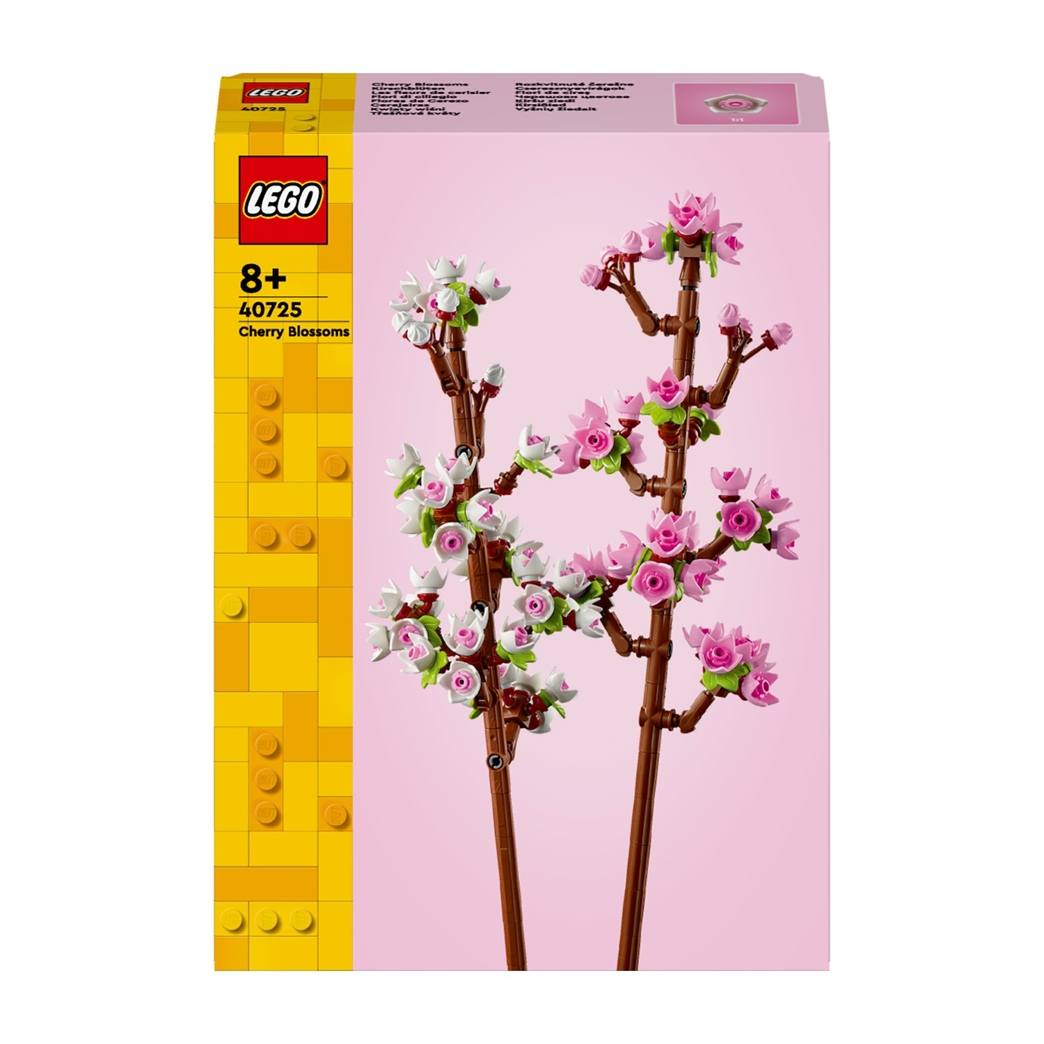 Scatola Lego del set Fiori di Ciliegio. La scatola mostra un albero di ciliegio fatto con mattoncini Lego. Lo sfondo è rosa e giallo.