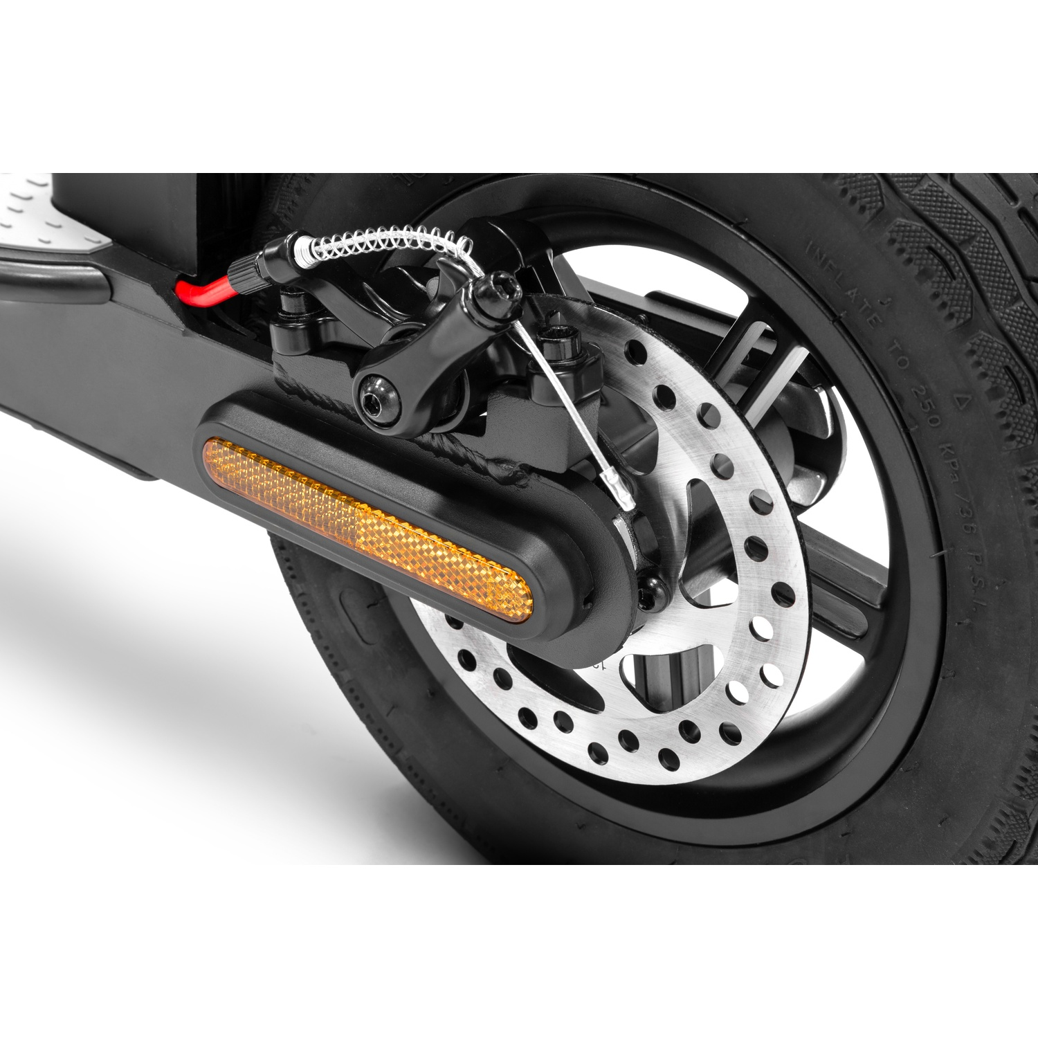 Close-up of an electric scooter's wheel. A black tire surrounds a silver disc brake with orange reflector and black frame.