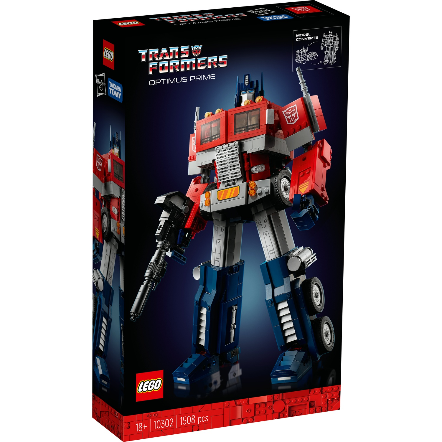 La scatola LEGO Transformers Optimus Prime mostra il robot in posizione eretta. La scatola è rossa, bianca, grigia e blu, con i loghi LEGO e Transformers.