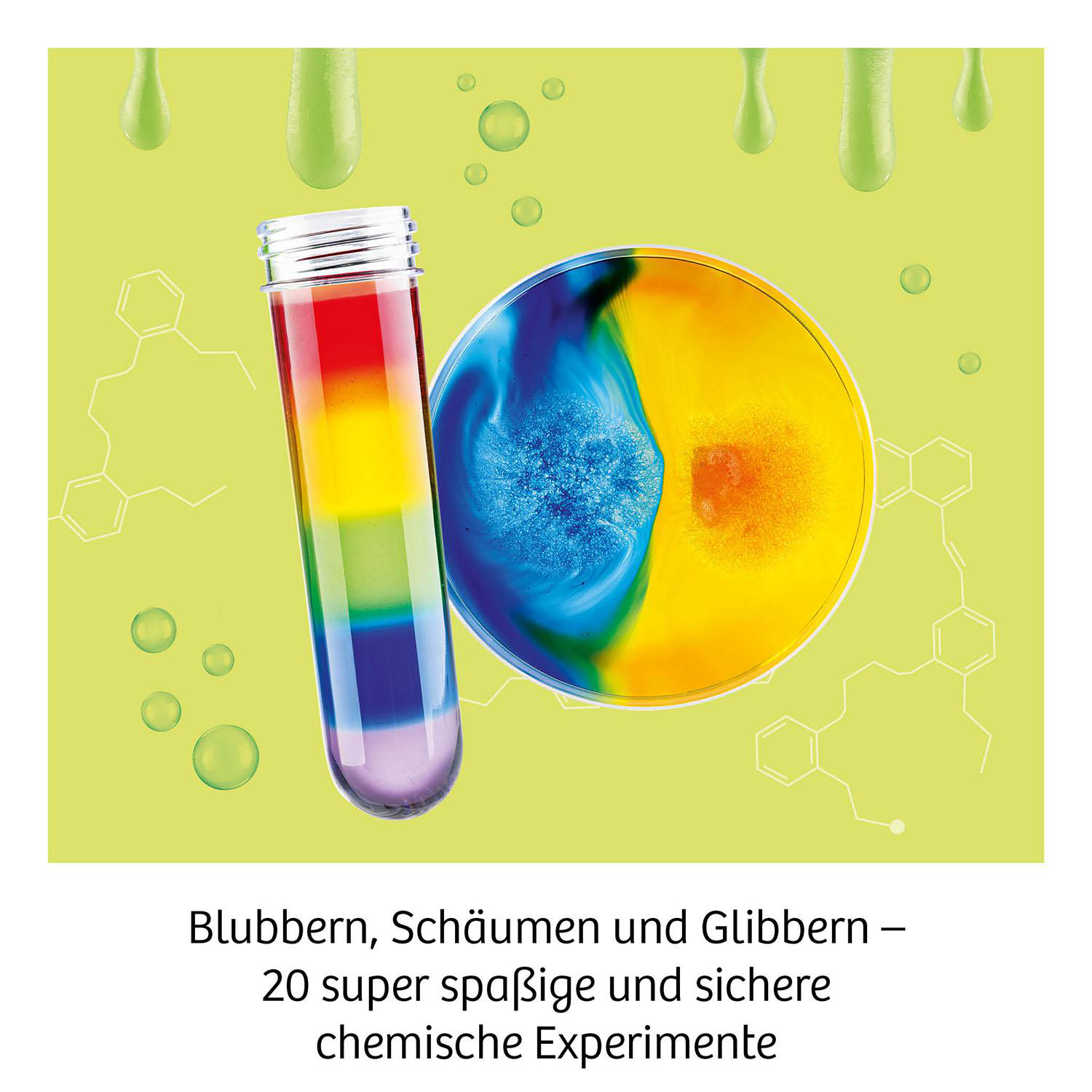 Ein Reagenzglas mit Regenbogenfarben und eine Petrischale mit blauen und gelben Flüssigkeiten auf grünem Hintergrund. Grüne Tropfen und Blasen.