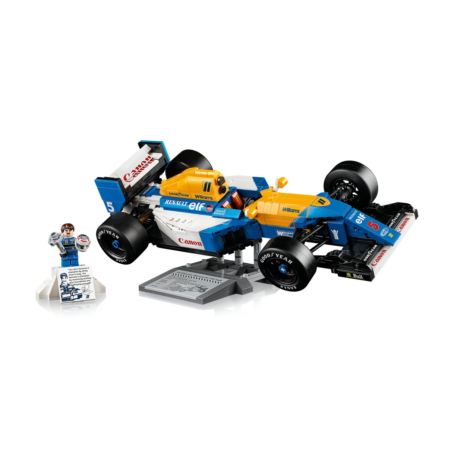 Un'auto di F1 Lego con colori blu, giallo e bianco. Una minifigure e una targa sono a sinistra. L'auto è su una piattaforma grigia.