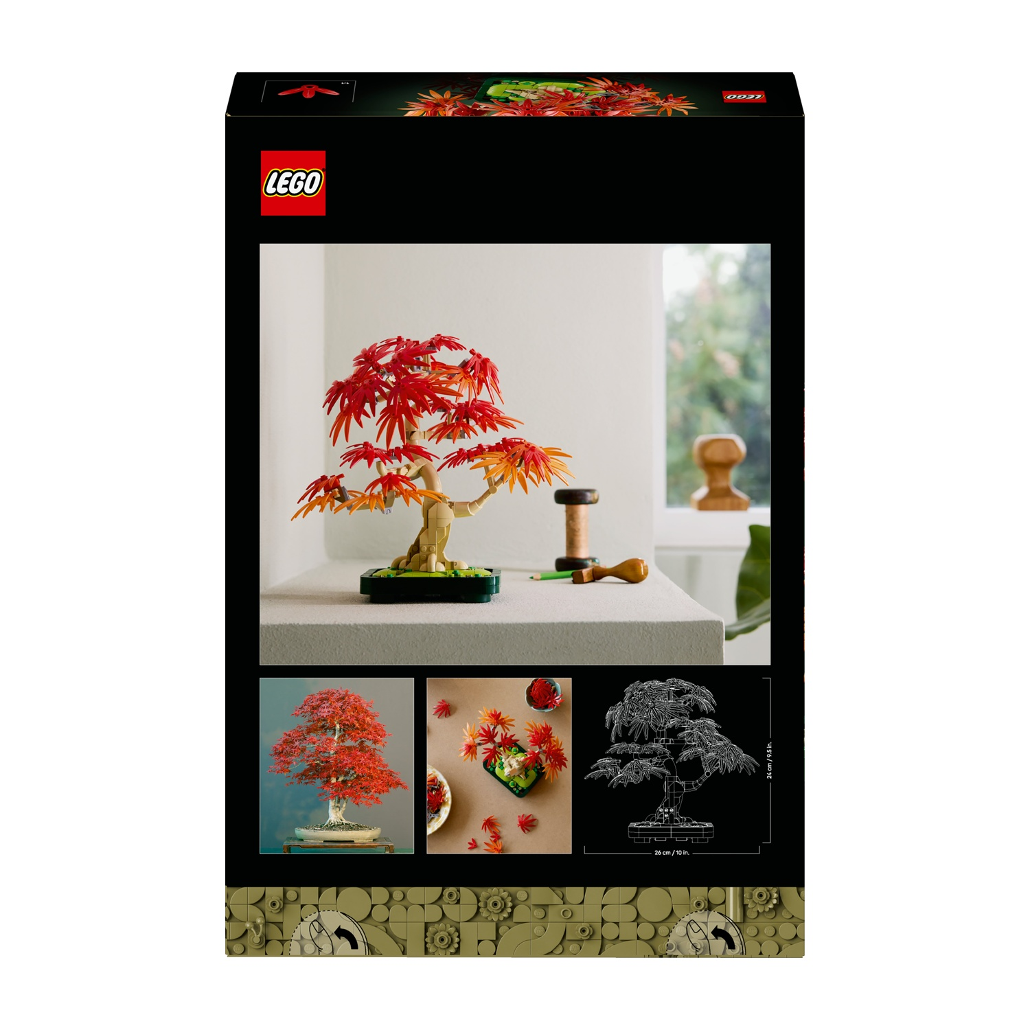 Scatola del set LEGO dell'albero bonsai. L'albero bonsai è su un tavolo. Foglie rosse e arancioni, base verde e sfondo in legno.
