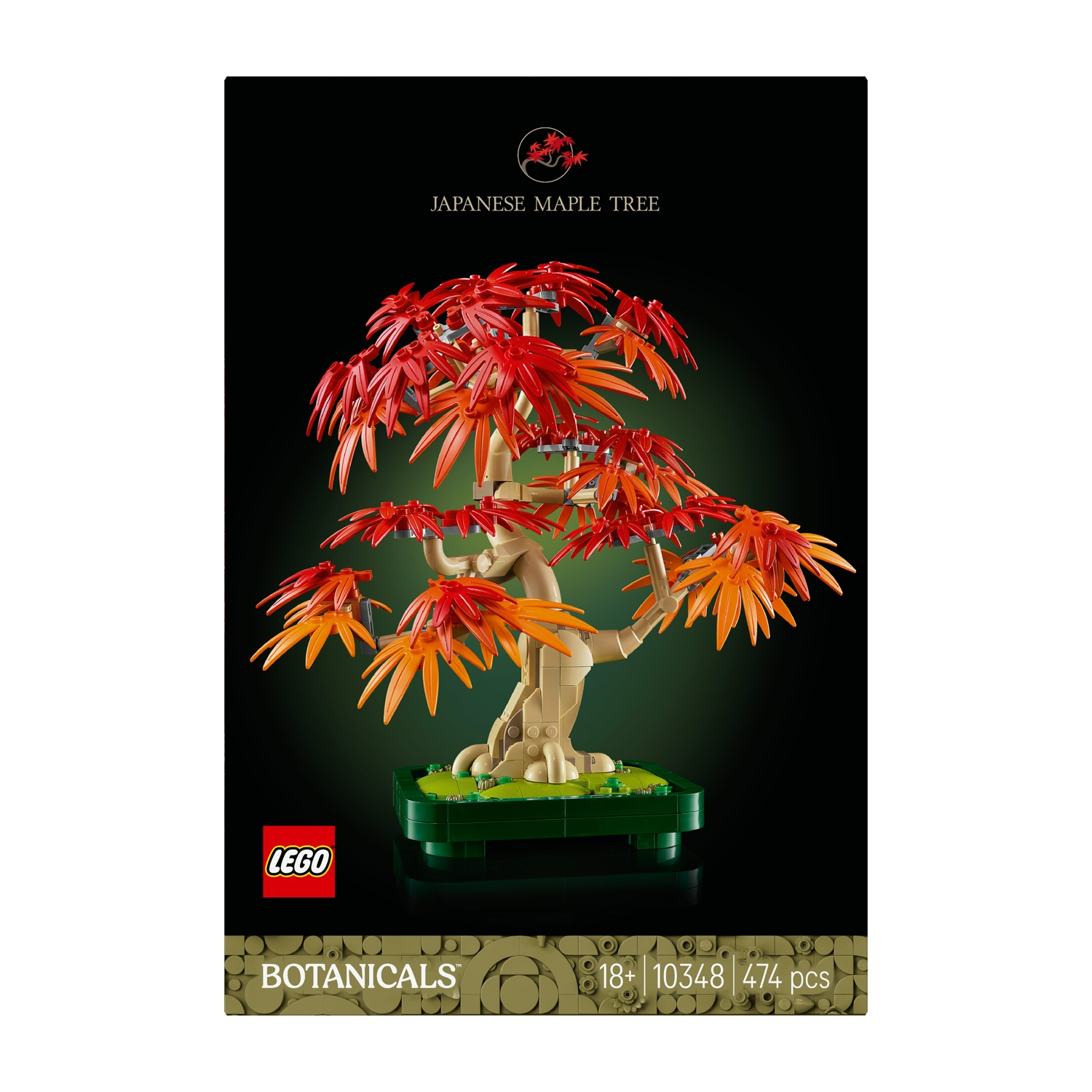Un albero di acero giapponese Lego con foglie rosse e arancioni. È su una base verde su uno sfondo verde scuro.