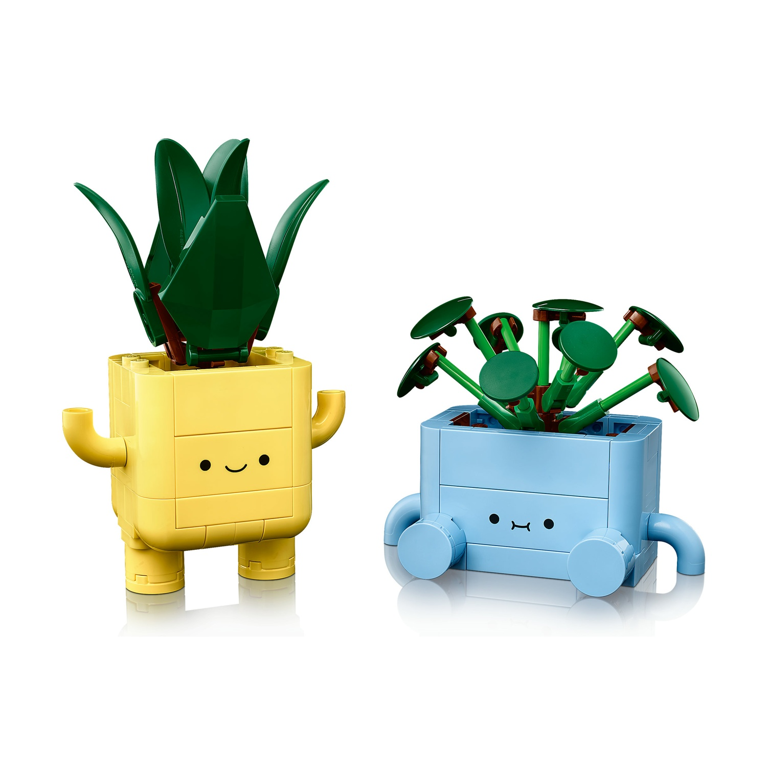 Due figure di piante Lego. Una gialla con foglie verdi e l'altra blu con foglie verdi circolari. Entrambi hanno facce.