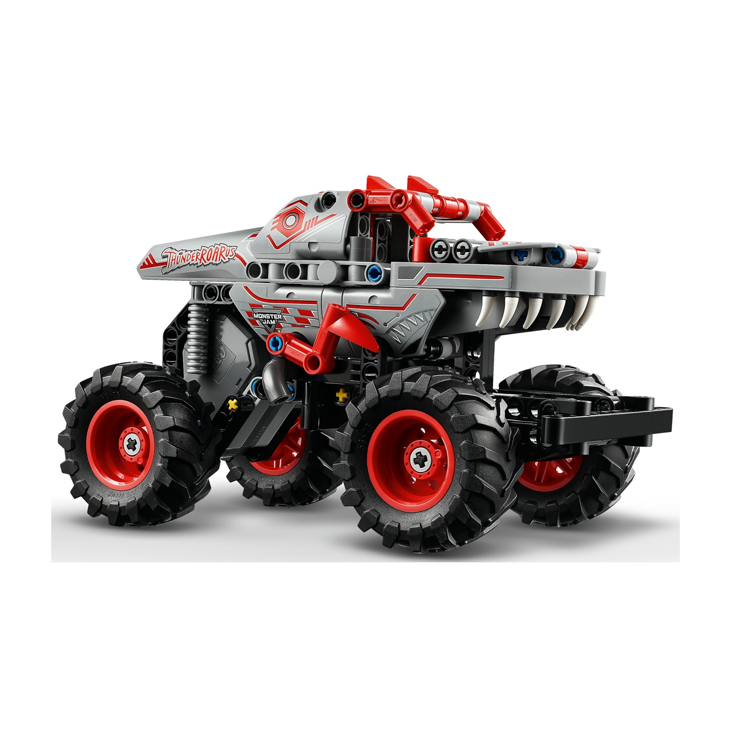 Un monster truck grigio e rosso fatto con i Lego. Ha grandi pneumatici neri con cerchi rossi. Il camion ha le parole "Thunder Roar".