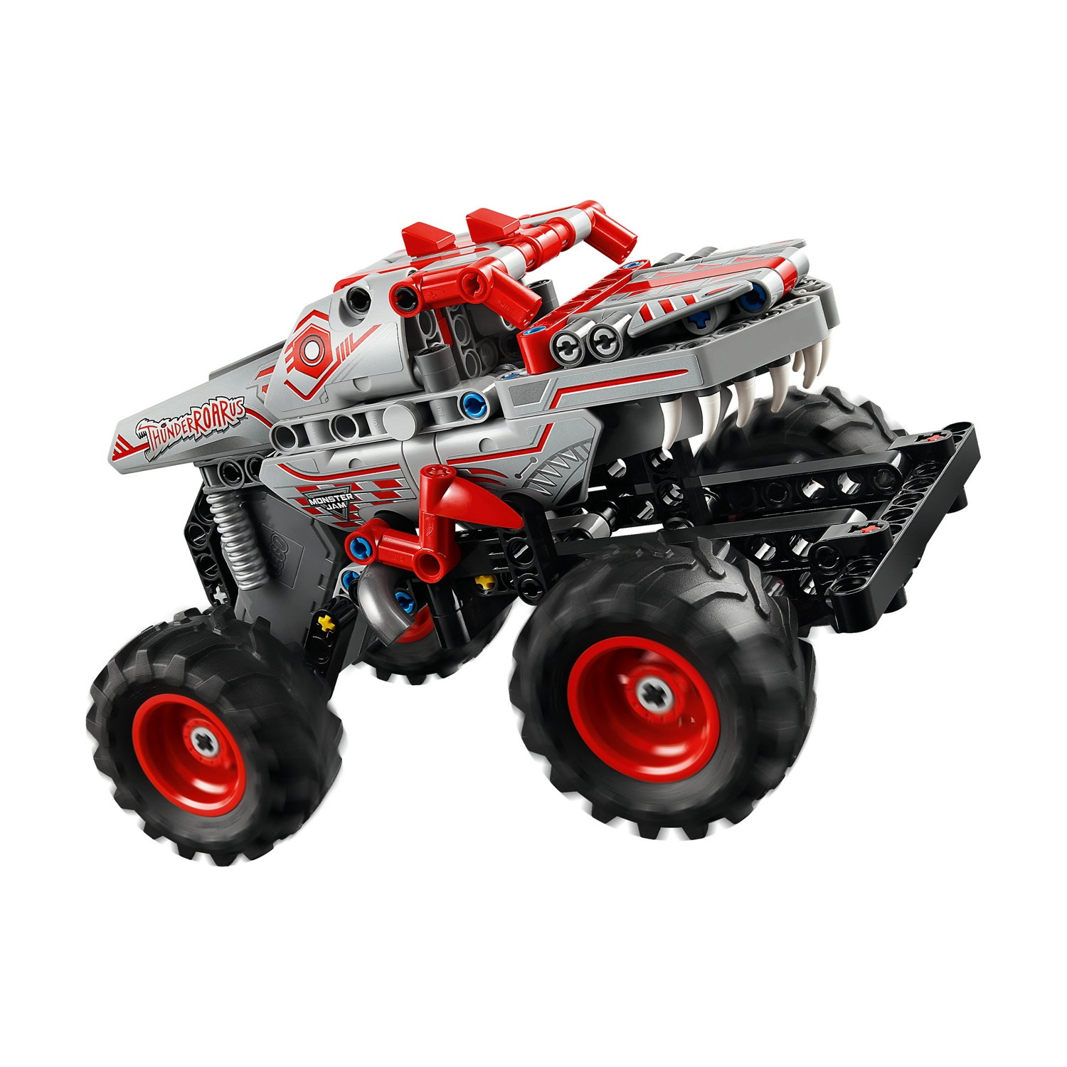 Un monster truck giocattolo grigio e rosso con grandi pneumatici neri e cerchi rossi, un design dettagliato, su sfondo bianco.