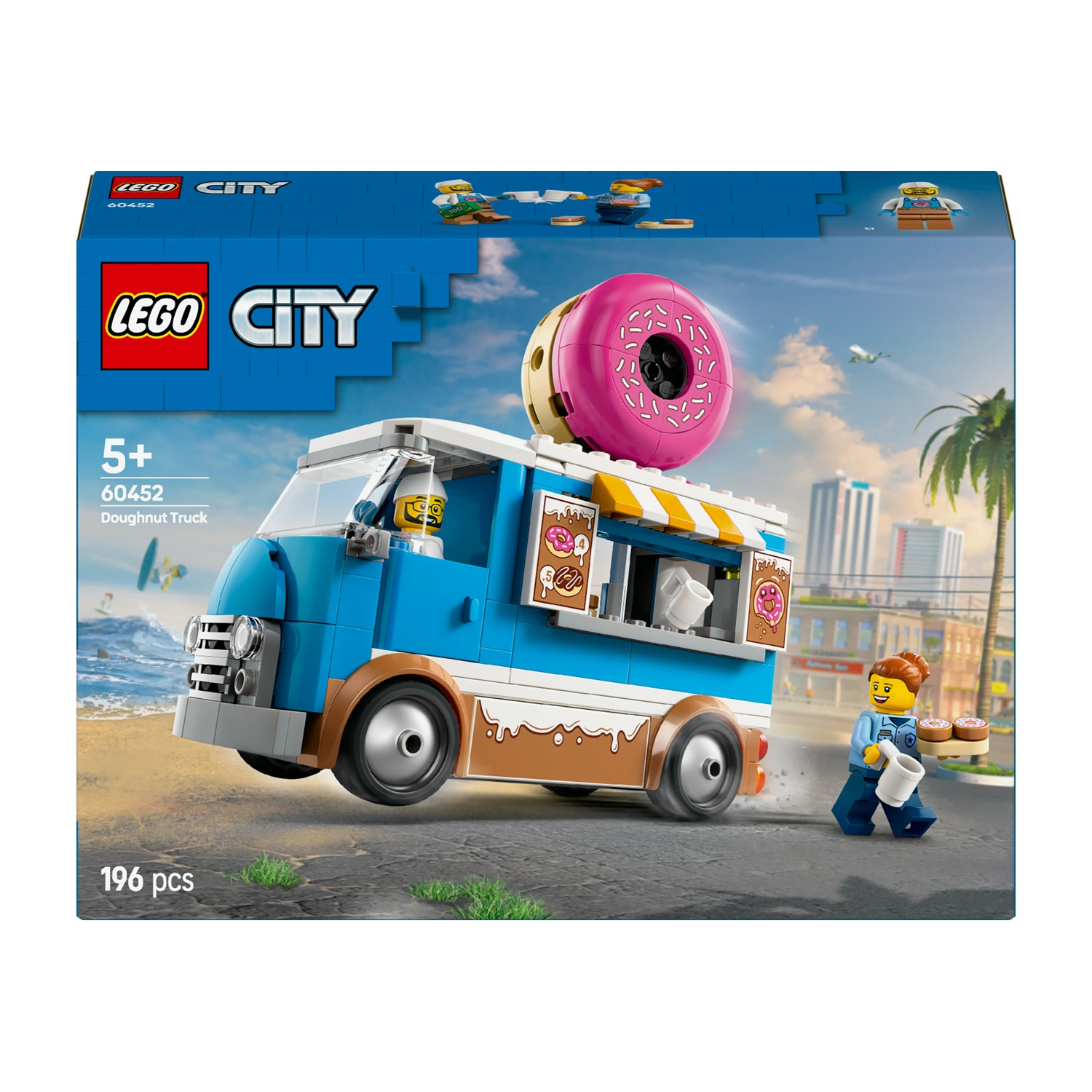 Set camioncino donut Lego City. Camion blu e marrone con un donut gigante sopra. Una minifigure vende donut e caffè.