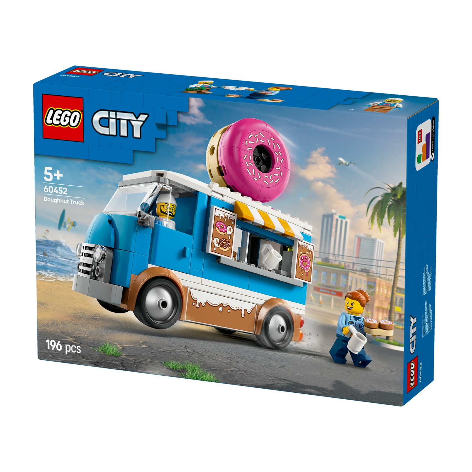 Scatola Lego City Doughnut Truck. La scatola mostra il camion con un grande donut rosa sopra. Una minifigure porta ciambelle e una tazza.