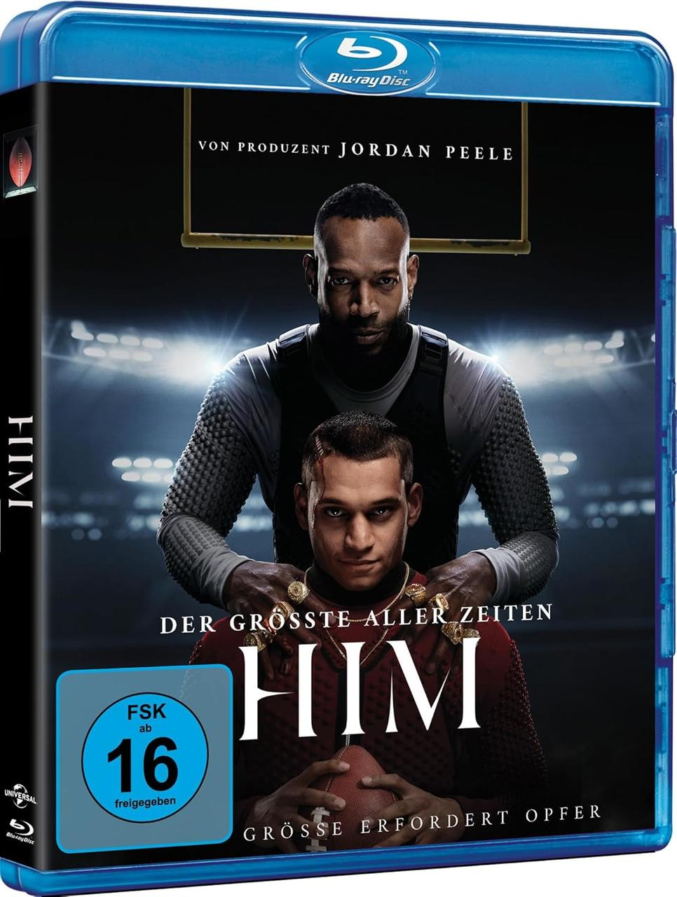 Blu-ray-Cover mit zwei Männern. Einer hält den anderen. Text lautet 'HIM' und 'Der Grösste aller Zeiten'. Die Disc hat eine FSK 16.