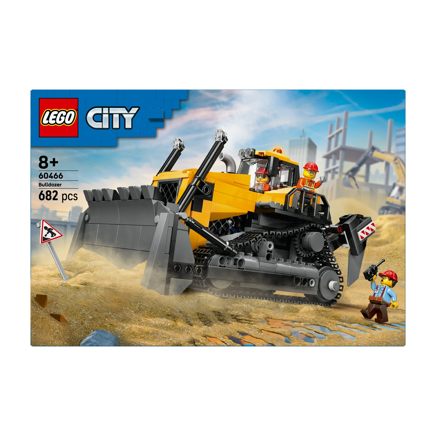 Set bulldozer Lego City. Bulldozer giallo con cingoli neri, due minifigure, cantiere sullo sfondo e segnale di avvertimento.