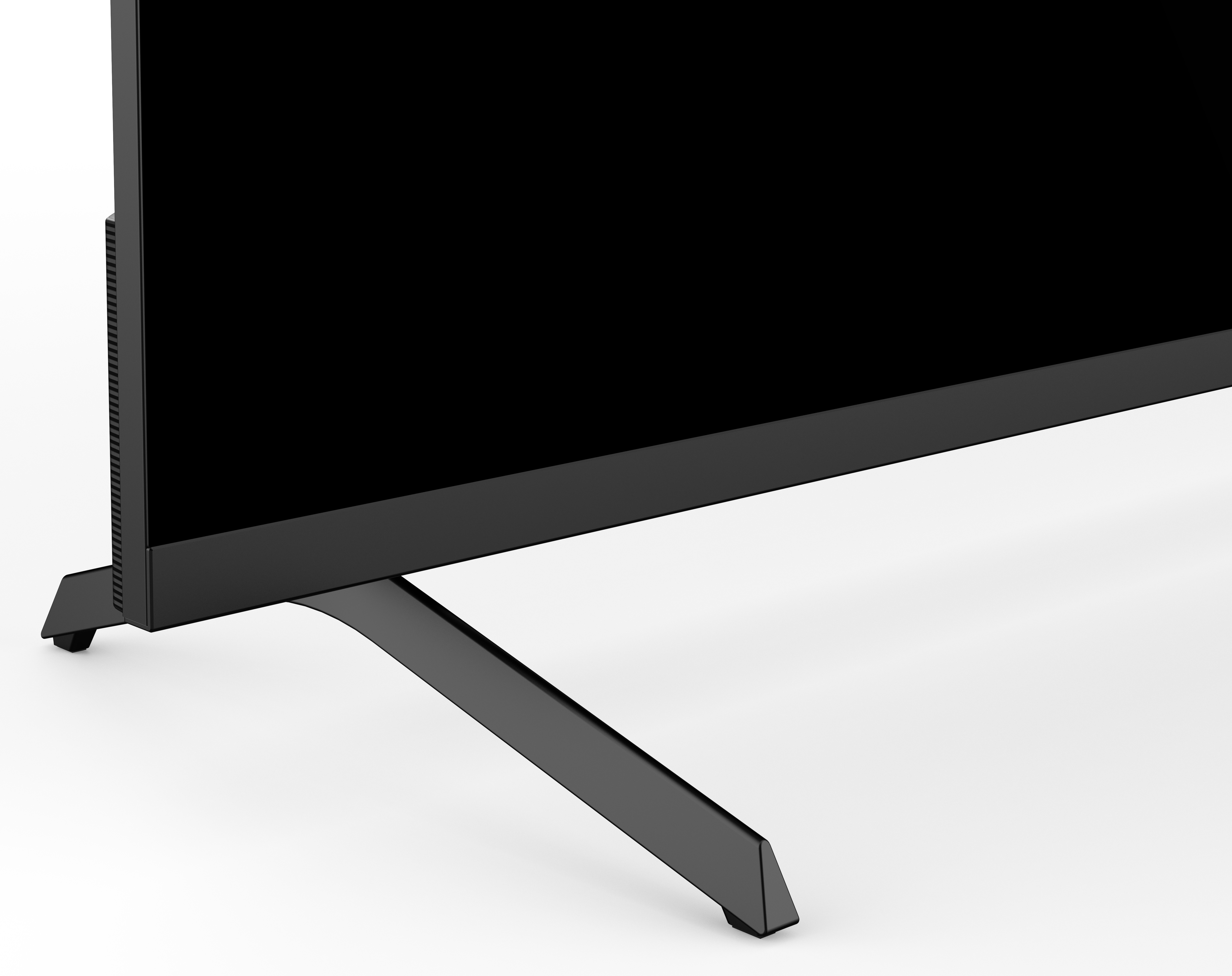 Czarny telewizor z czarną podstawą na białym tle. Podstawa jest pochylona.